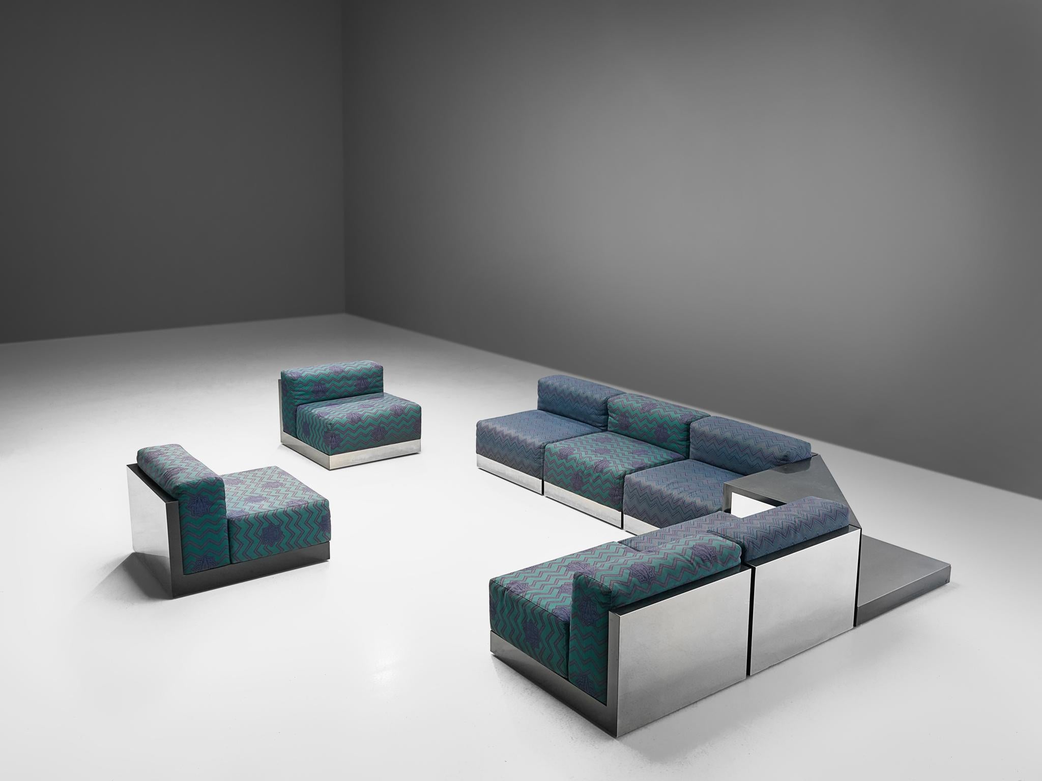 Sectional sofa, laminated wood, steel, fabric, Italy, 1980s

A Postmodern modular Livingroom set, consisting of 7 seating elements and one corner element usable as a side table. A perfect piece to place in a large space as it can be positioned as