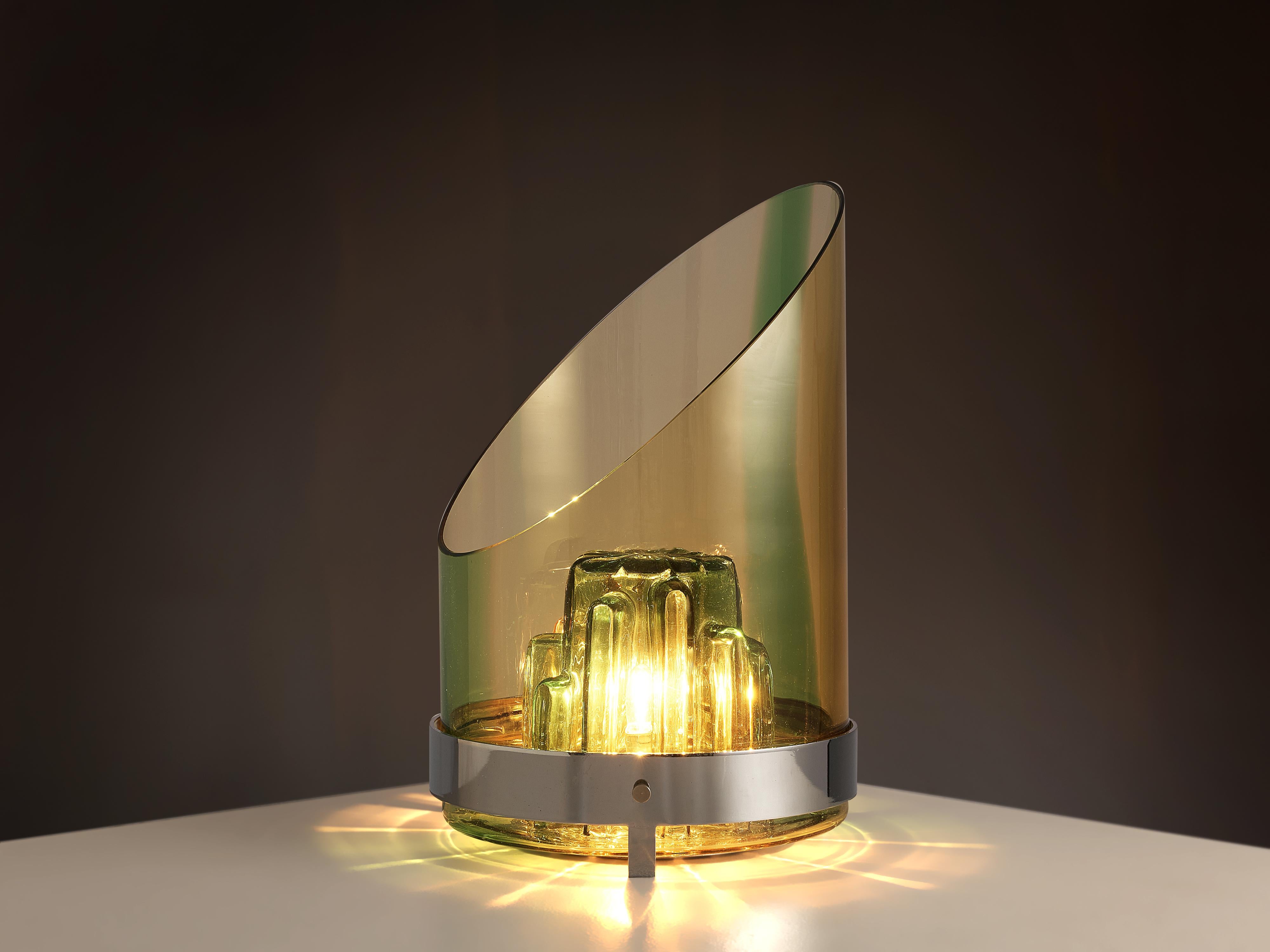 Table lamp, metal, glass, Italy, 1980s

Eye-catching table lamp that functions as a great example of Italian postmodern design. The lamp consists of two elements. In the inside a light bulb is surrounded by a small stone-like form with a haptic