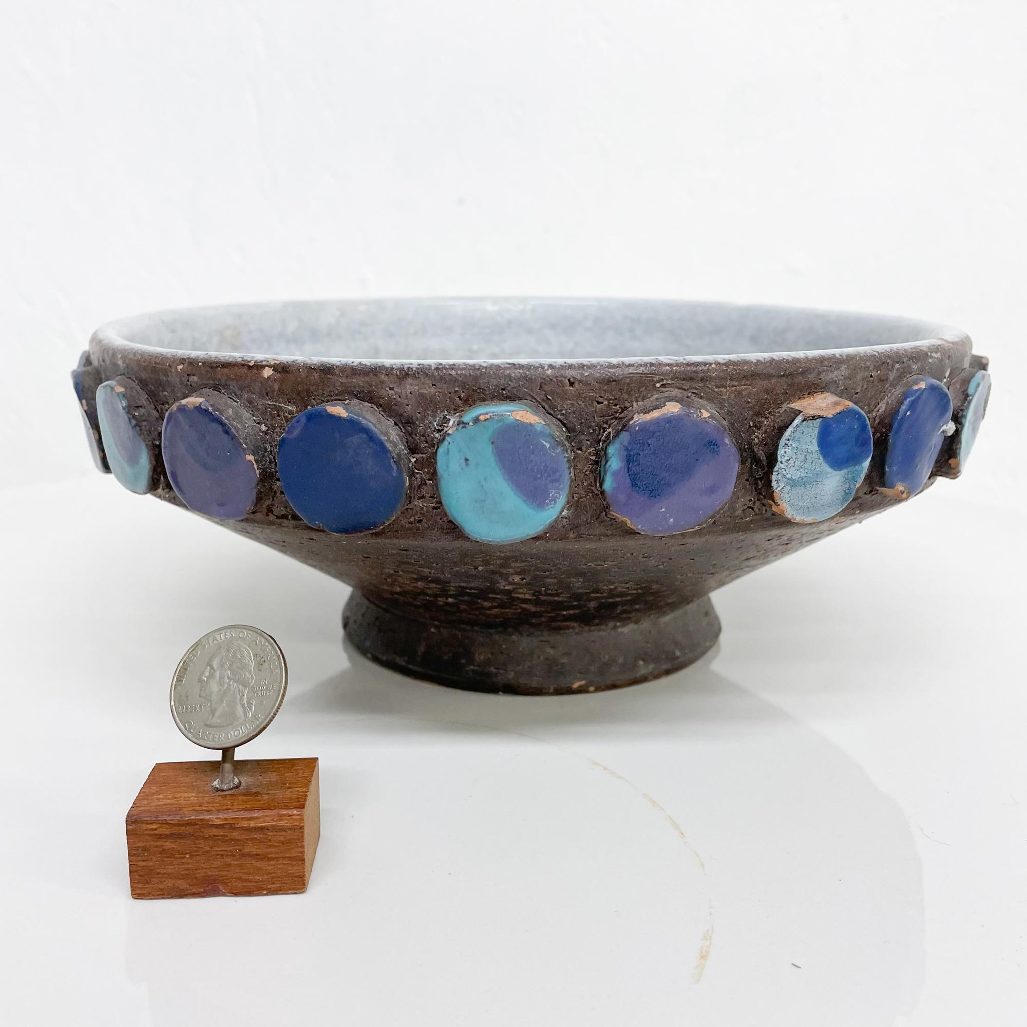 MCM 1960s Italian Pottery attributed to Bitossi Raymor 
Decorative Bowl Catch All Turquoise Medallion Design 
Signed Italy
10 in diameter x 3.75 Tall inches
Preowned Unrestored Original Vintage Condition.
Nicks present around edges.
Refer to all