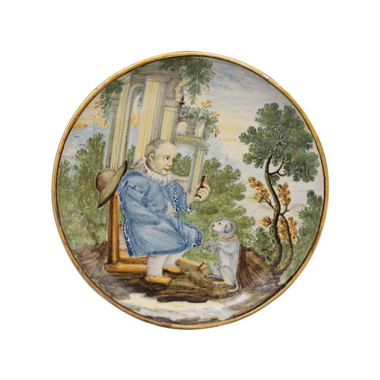 Italian Pottery Handpainted Dish with Male Figure Offering a Morsel 17th Century For Sale
