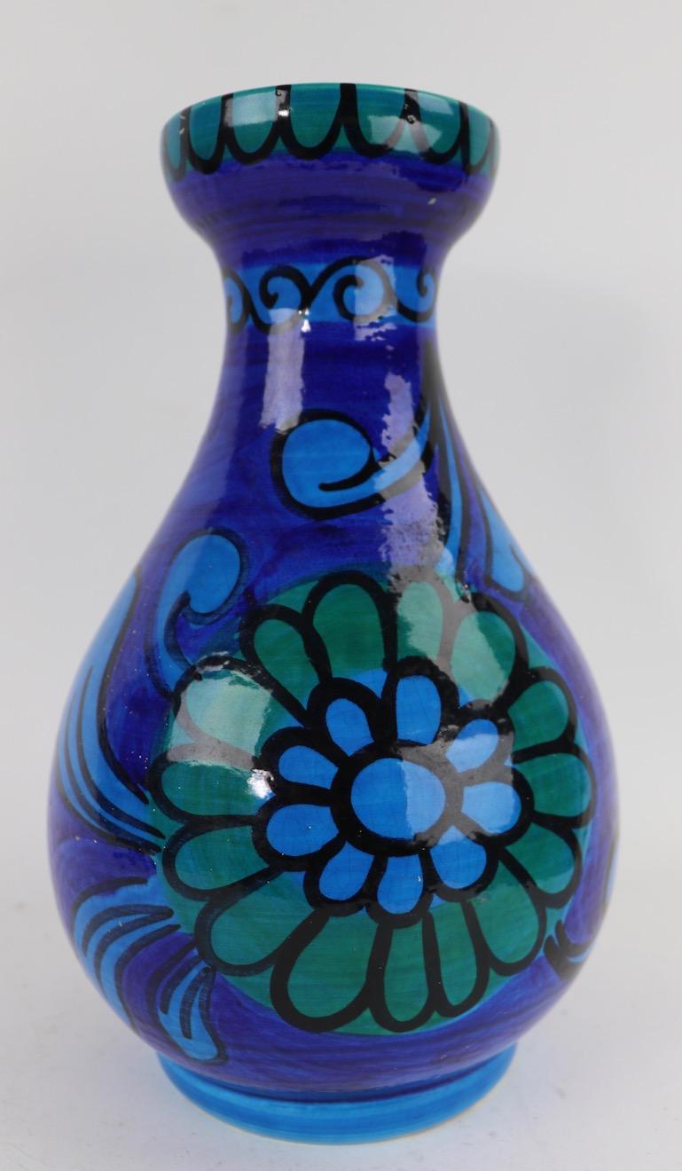Nice Italian pottery vase have blue tone ground and flower foliate motif. Signed Italy and numbered. Minor glaze skips, normal and consistent with age.
 