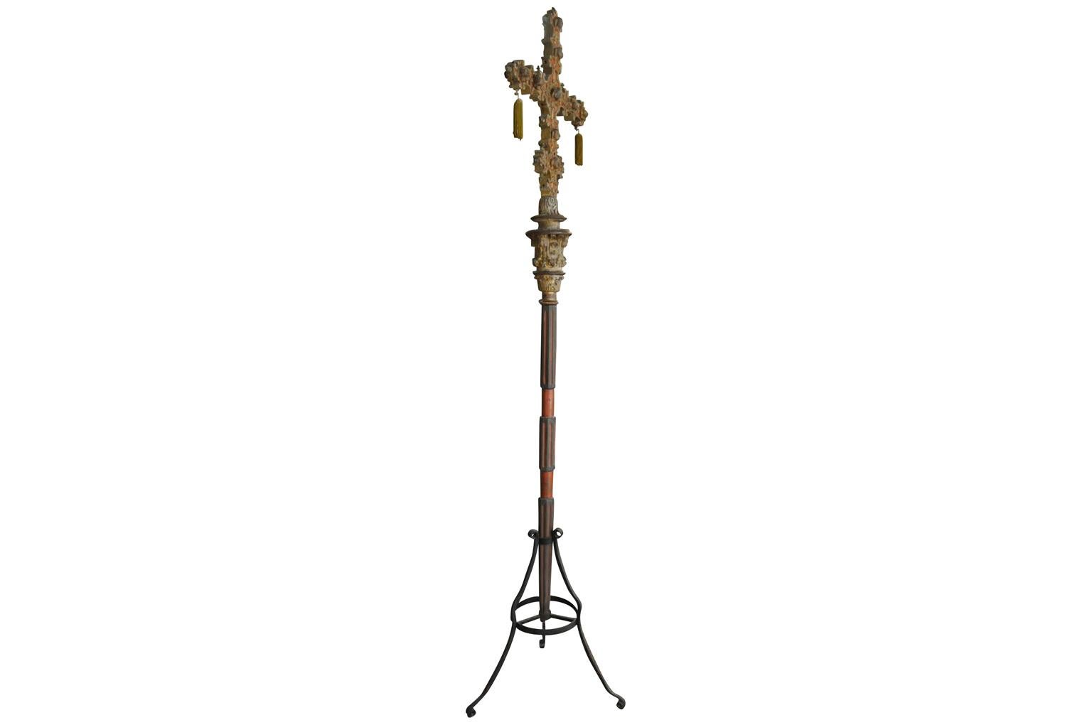 A stunning late 17th-early 18th century processional cross from Venice - housed in its iron stand. The magnificent piece is made from carved wood with beautiful polychrome and gilding. The cross is in 4 sections. An exceptional piece.