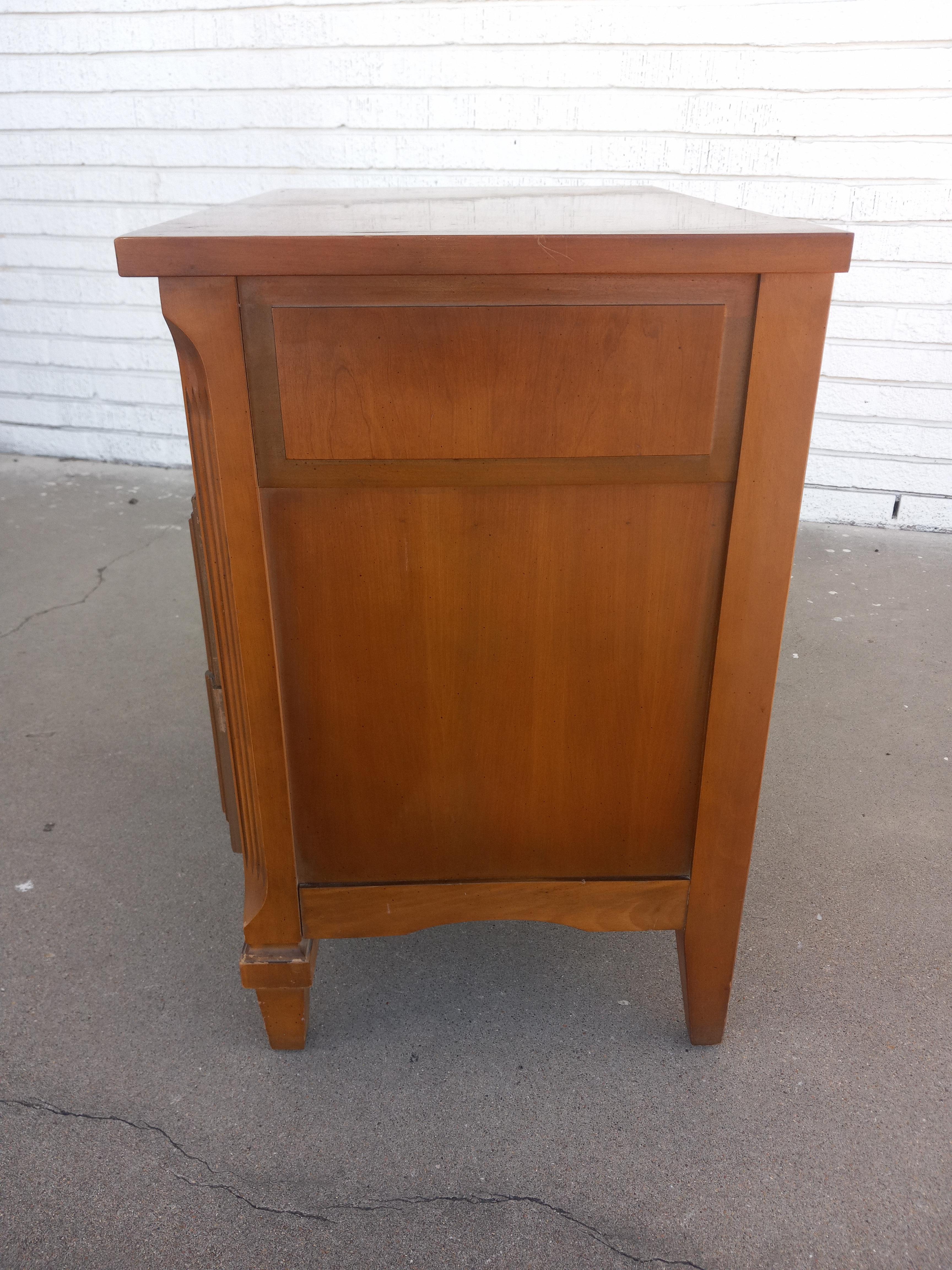 Vintage Walnut French Provincial 3 Drawer Chest

This elegant French Provincial chest features a warm walnut finish and classic vintage styling. The piece includes three spacious drawers, each adorned with ornate brass hardware that enhances its