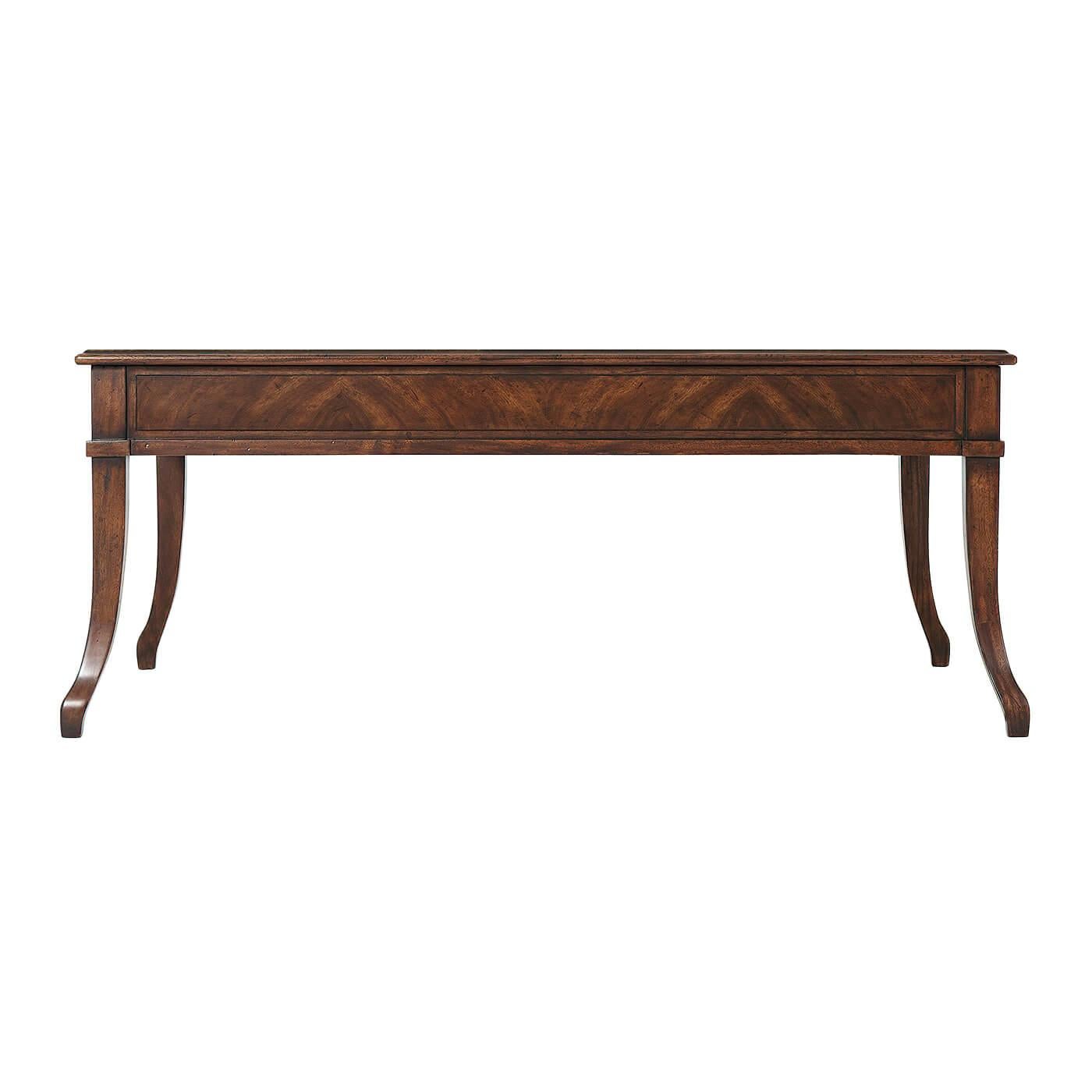 A Provincial Italian coffee table, the rectangular crossbanded top above two end drawers and raised on sweeping splayed legs. 

Dimensions: 45