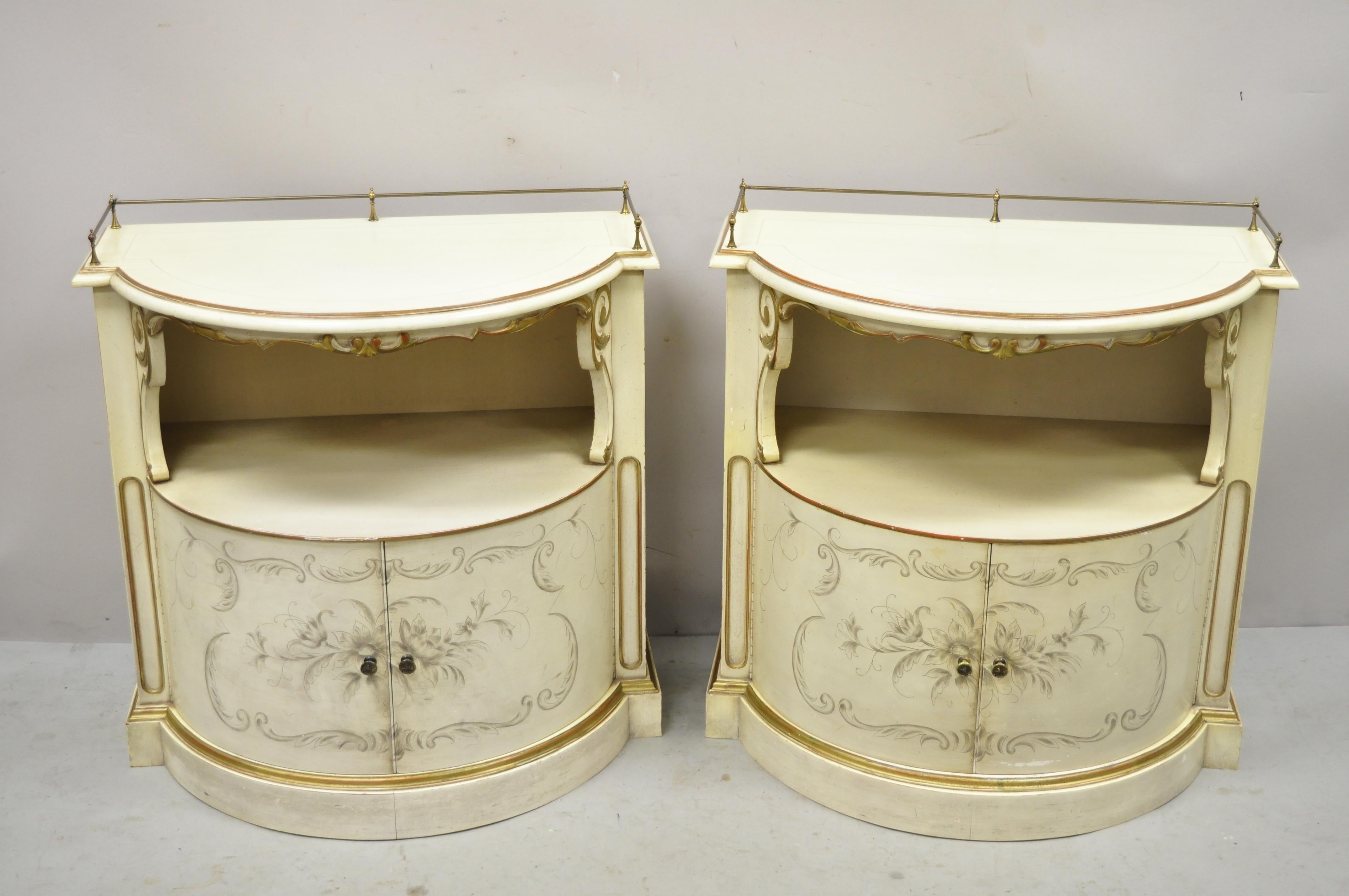 Italian Provincial Cream Half Round Demilune Nightstand Bedside Cabinet - a Pair. Item features paint decorated door front and sides, brass gallery, shapely demilune form, great style and form. Circa Mid 20th Century. Measurements: 27.5