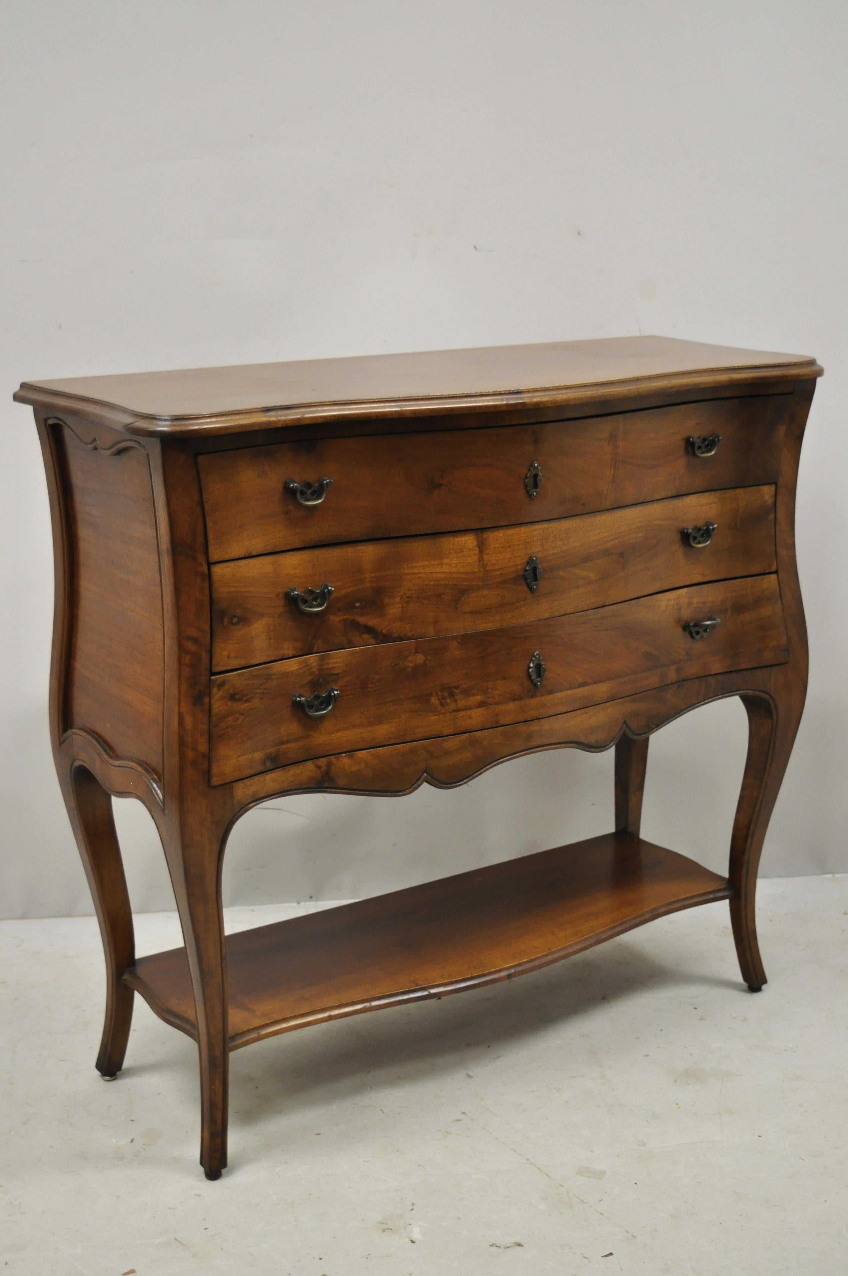Italian Provincial French Louis XV style Cherrywood commode chest by B. Altman

Details: Lower shelf, solid wood construction, beautiful wood grain, original label, 3 dovetailed drawers, shapely cabriole legs, quality Italian craftsmanship, great