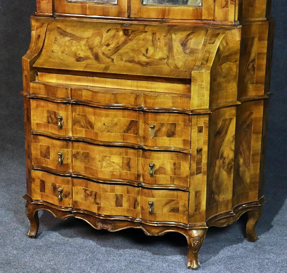 Italian Provincial style olivewood secretary desk with 2 doors with eglimose mirrored fronts containing 1 shelf and 2 drawers over a drop desk and 3 drawers.