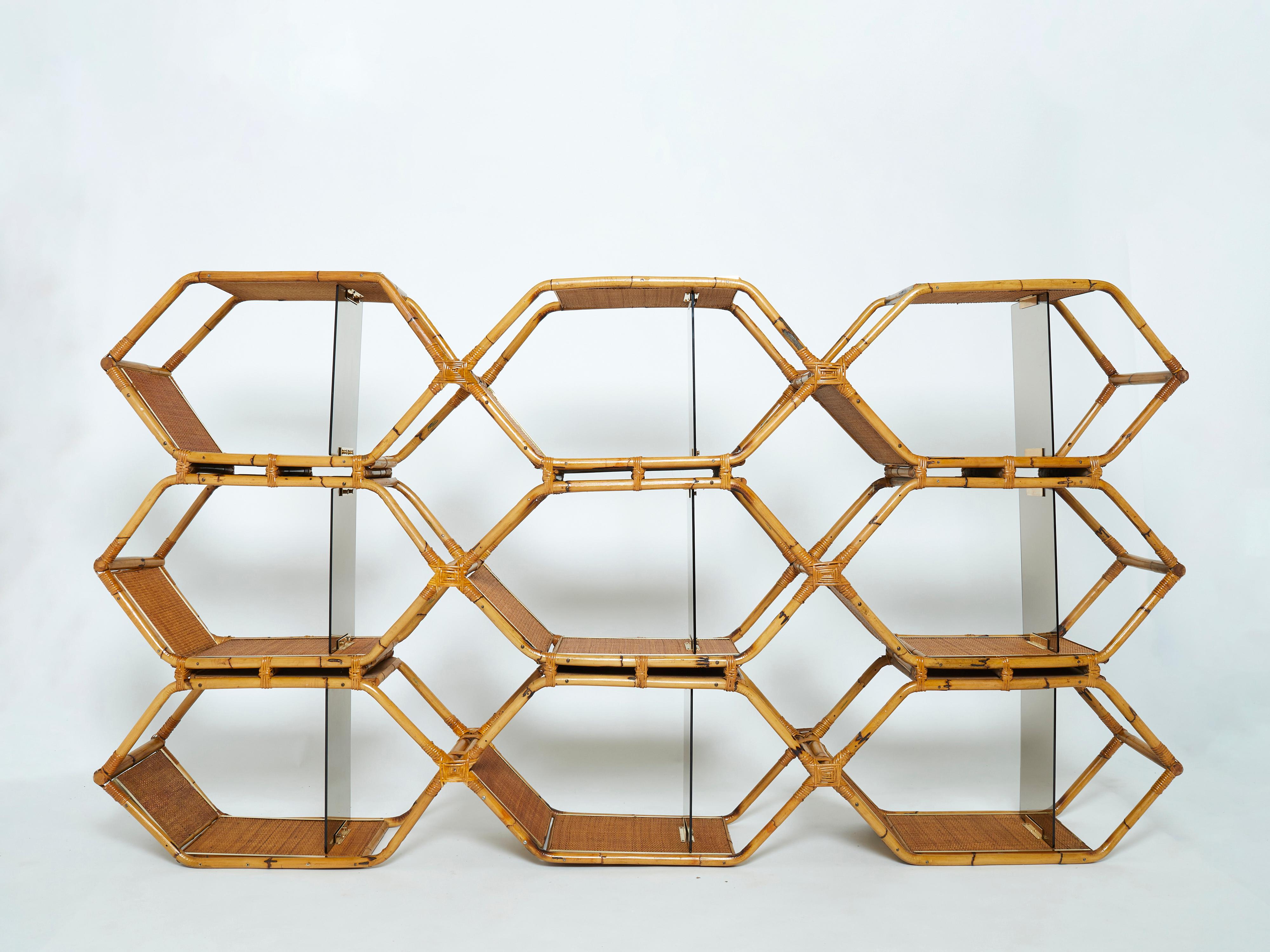 Functional and stylish, this shelving unit or bookcase was made from natural bamboo, with cane joints and luxe displays of brass inserts in Italy in the mid-1970s. It was designed by Giusto Puri Purini and Maurizio Mariani for Vivai Del Sud in 1976.