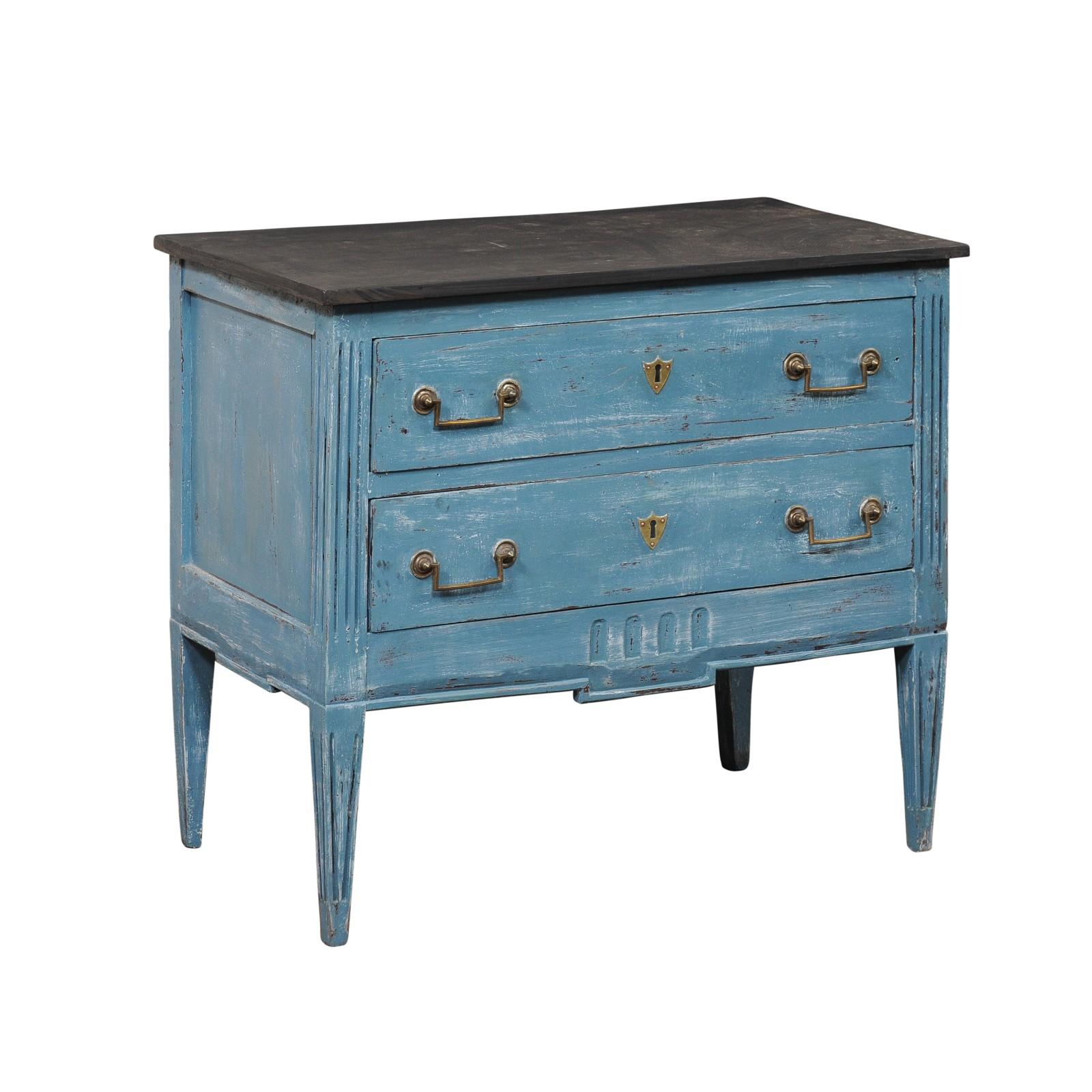An Italian painted wood raised chest of two drawers. This vintage chest from Italy has been nicely cobbled together from various older pieces, giving it a much older look than it is. The case houses a pair of drawers, each fitted with rectangular