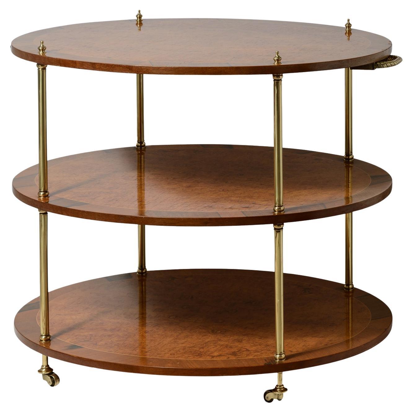 Italian Rare  Three Tier Oval End Table on Casters in Burl Wood & Brass For Sale