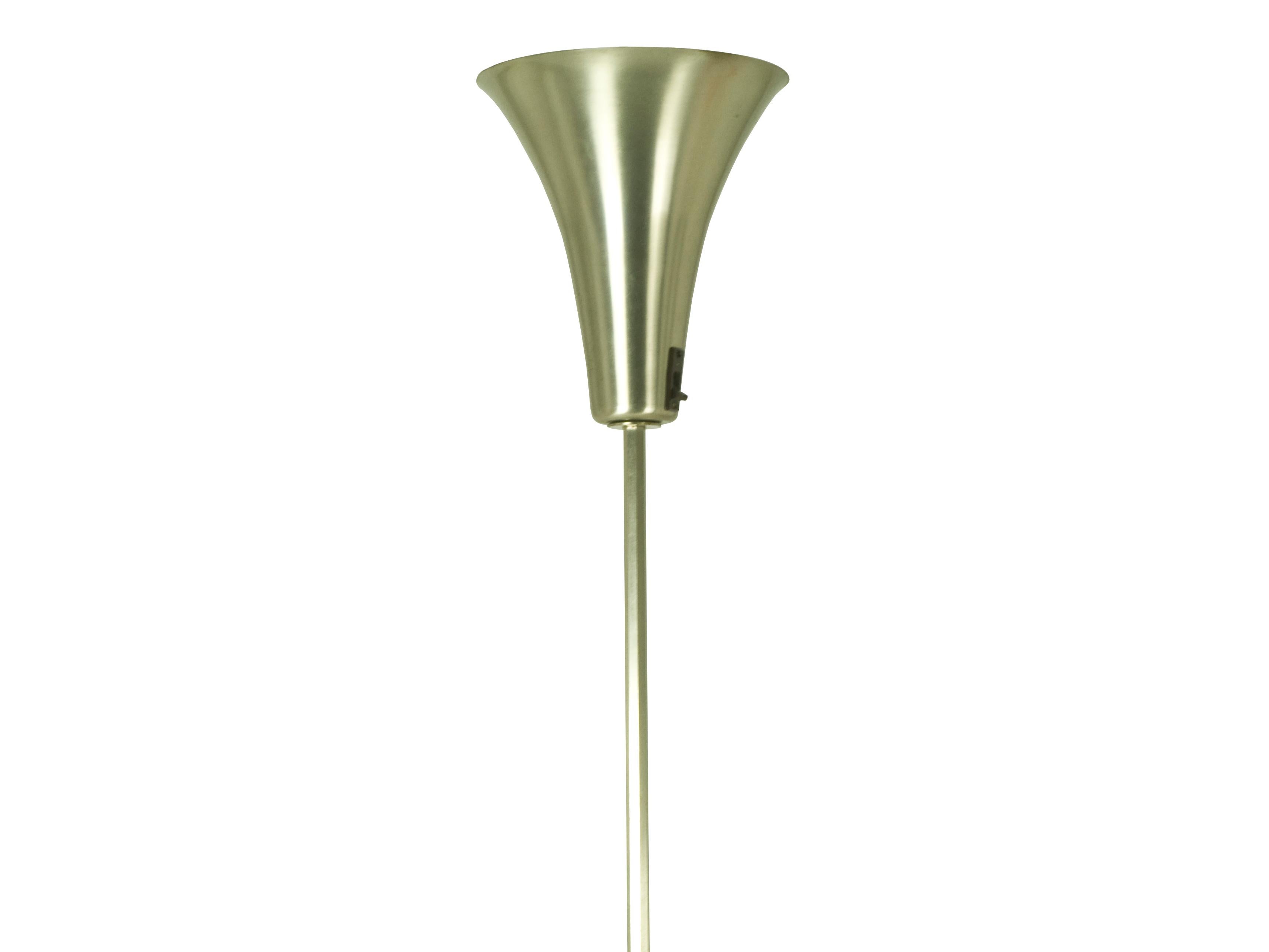 This Luminator/floor lamp was designed and produced in Italy around the 1940s. It is made from nickeled brass and aluminium and it remains in good vintage condition: sign and wear consistent with age and use; its original bakelite switch on the