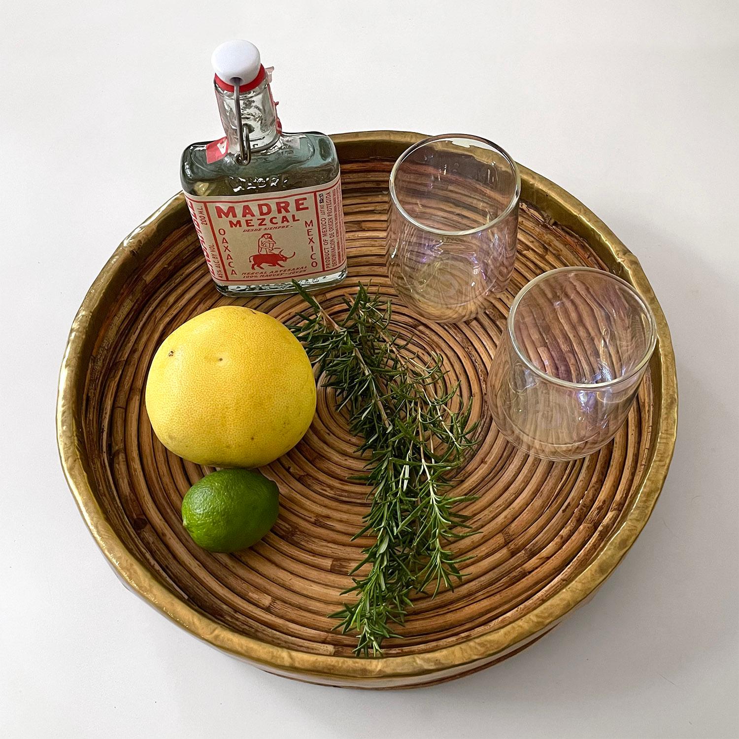 Italian rattan and brass tray in the style of Gabriella Crespi
Coiled rattan with natural color variations
Aged brass rim
Patina from age and use
Wonderful addition to any surface 