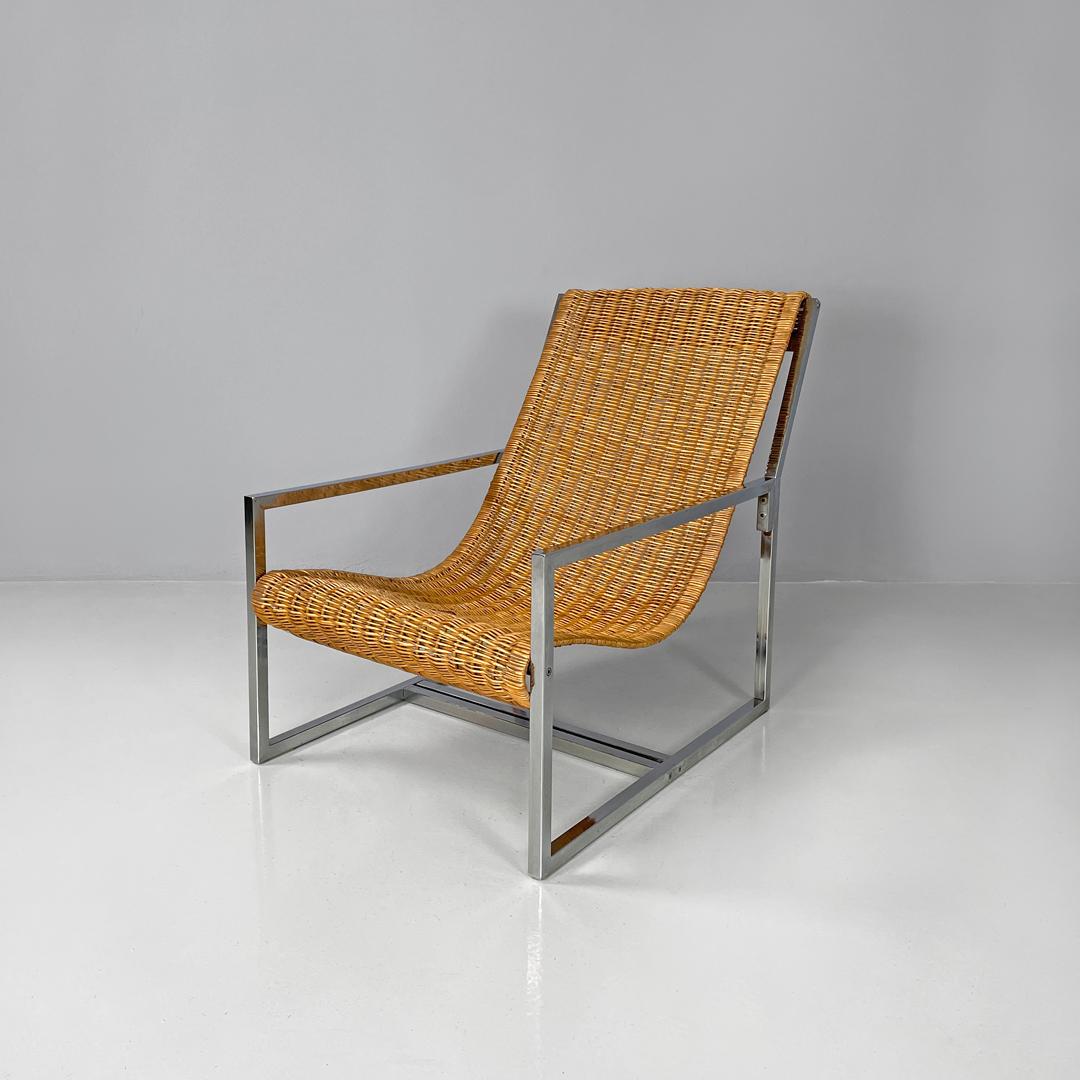 Italian rattan and chromed metal armchair by Lyda Levi, 1970s
Armchair with rectangular base. The supporting structure is made of chromed metal rod with a square section, and makes up the armrests, the legs and the seat and backrest support. The