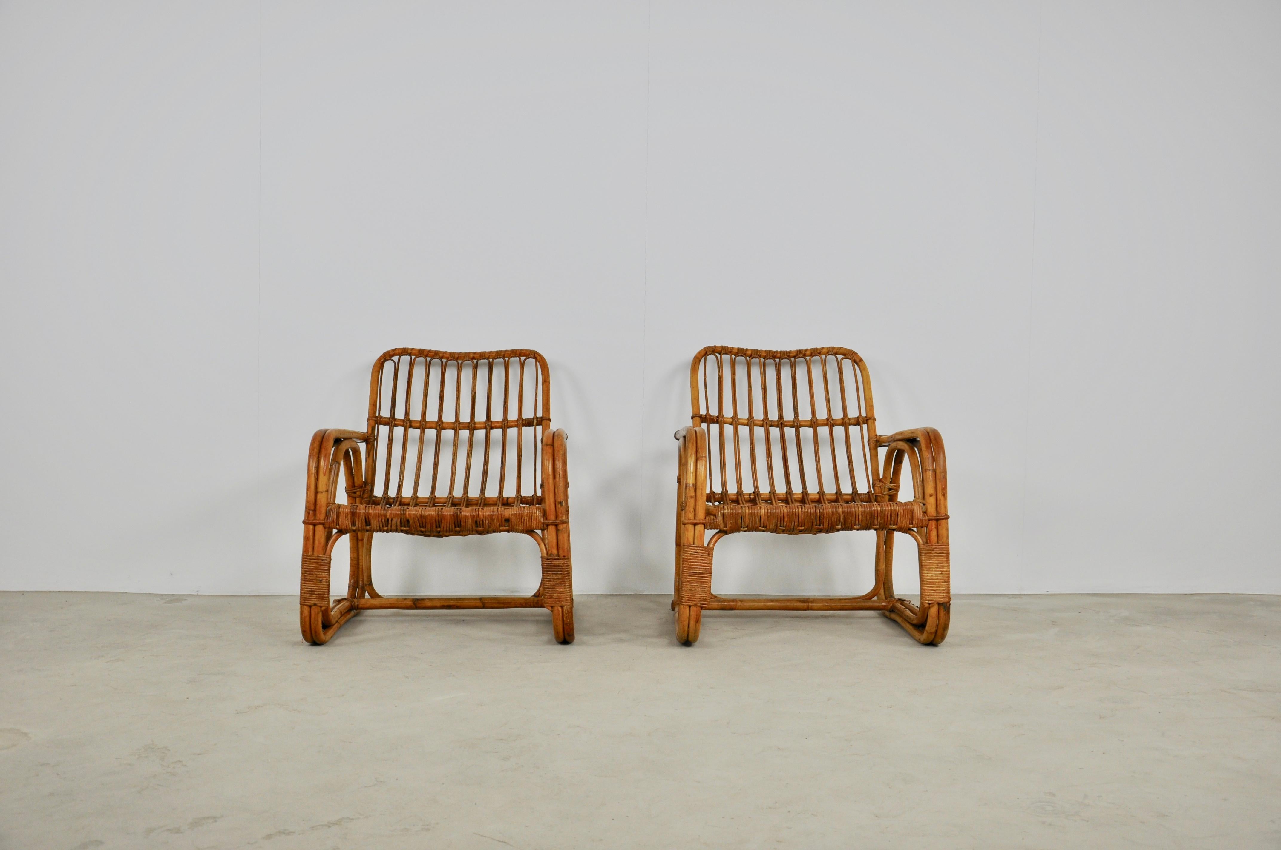 Pair of rattan armchairs. Slight wear and tear due to the age of the armchairs. Size: Seat height 37cm.