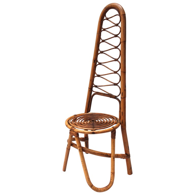 Italian rattan chair in the style of Gabriella Crespi, 1960s. Offered by Jed