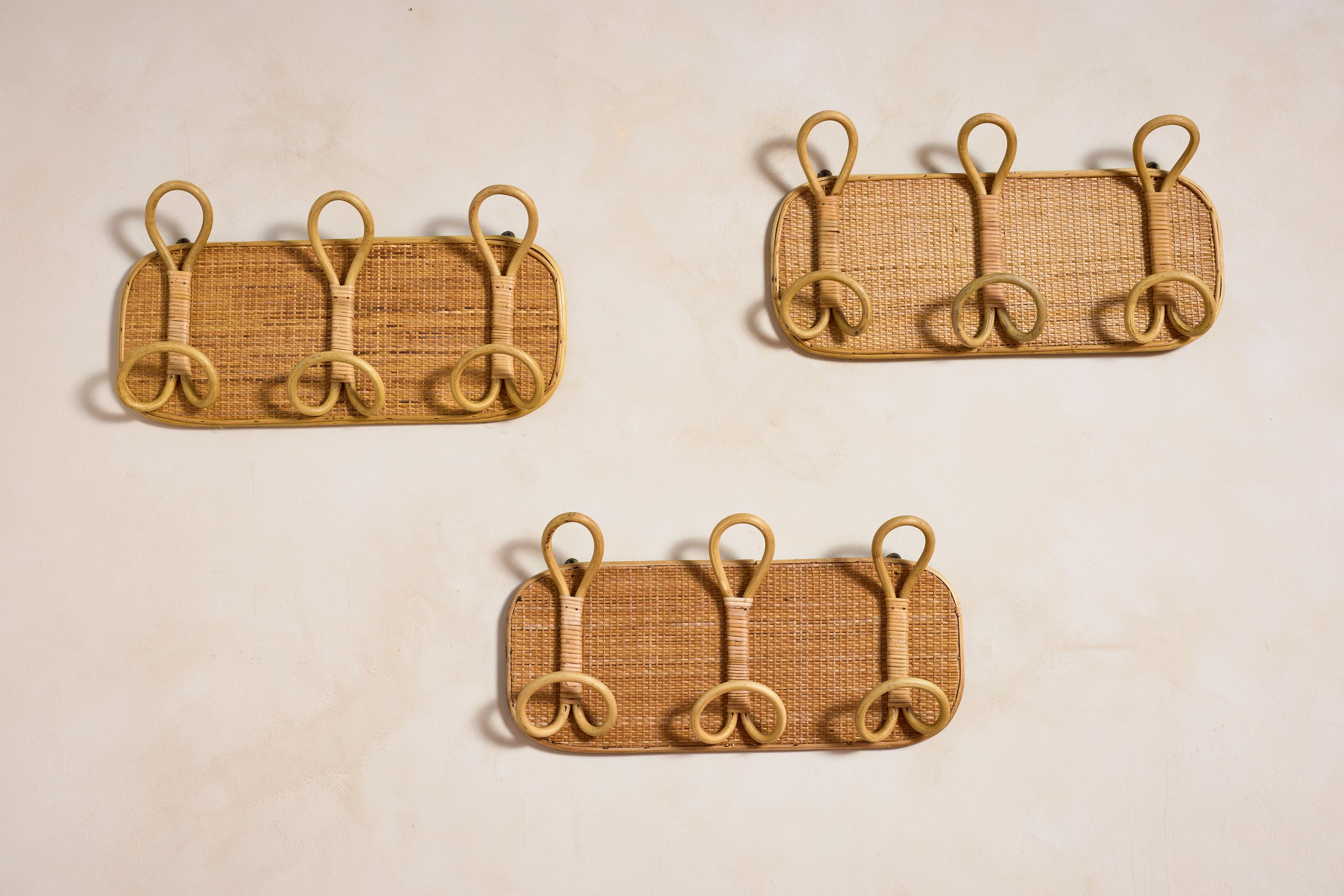 Italian Rattan Wall-Mounted Coat Racks, Italy 1960s

Constructed with natural woven rattan and wicker with three large loop bamboo hooks

Three available, priced individually