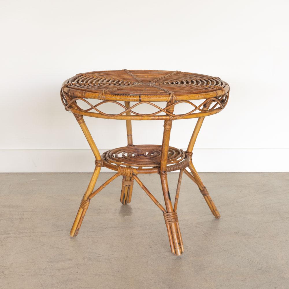 Great two-tier rattan gueridon table from Italy, 1960's. Original rattan with circular rattan top, beautiful wavy rattan detail around edge and wrapped rattan detailing on legs. Perfect as a side table or between two chairs. 