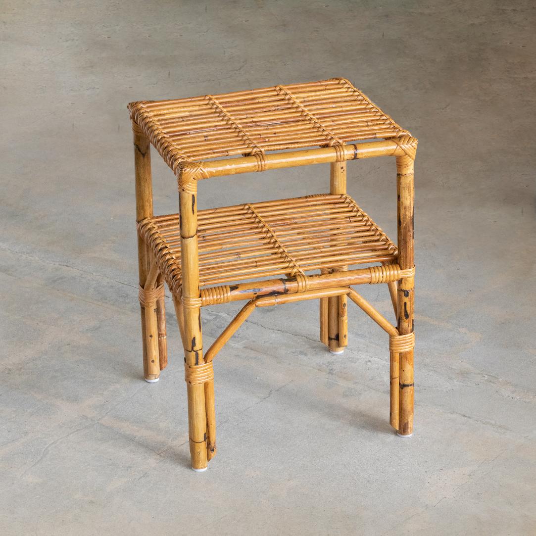 Lovely small two-tier rattan side table from Italy, 1960's. Original rattan slatted top and lower shelf with wrapped rattan detailing on legs. Perfect as side table next to sofa or bed.