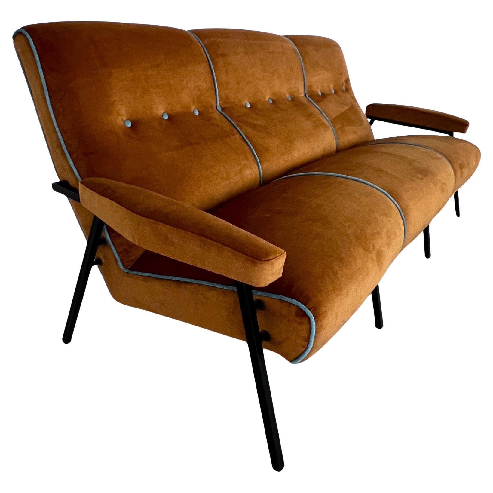 Elegant Italian sofa, produced in the 60s with the typical square metal legs.
The sofa has been completely refurbished and reupholstered with high-quality interior material and super-soft easy-care velvet on the outside.
The color is a warm