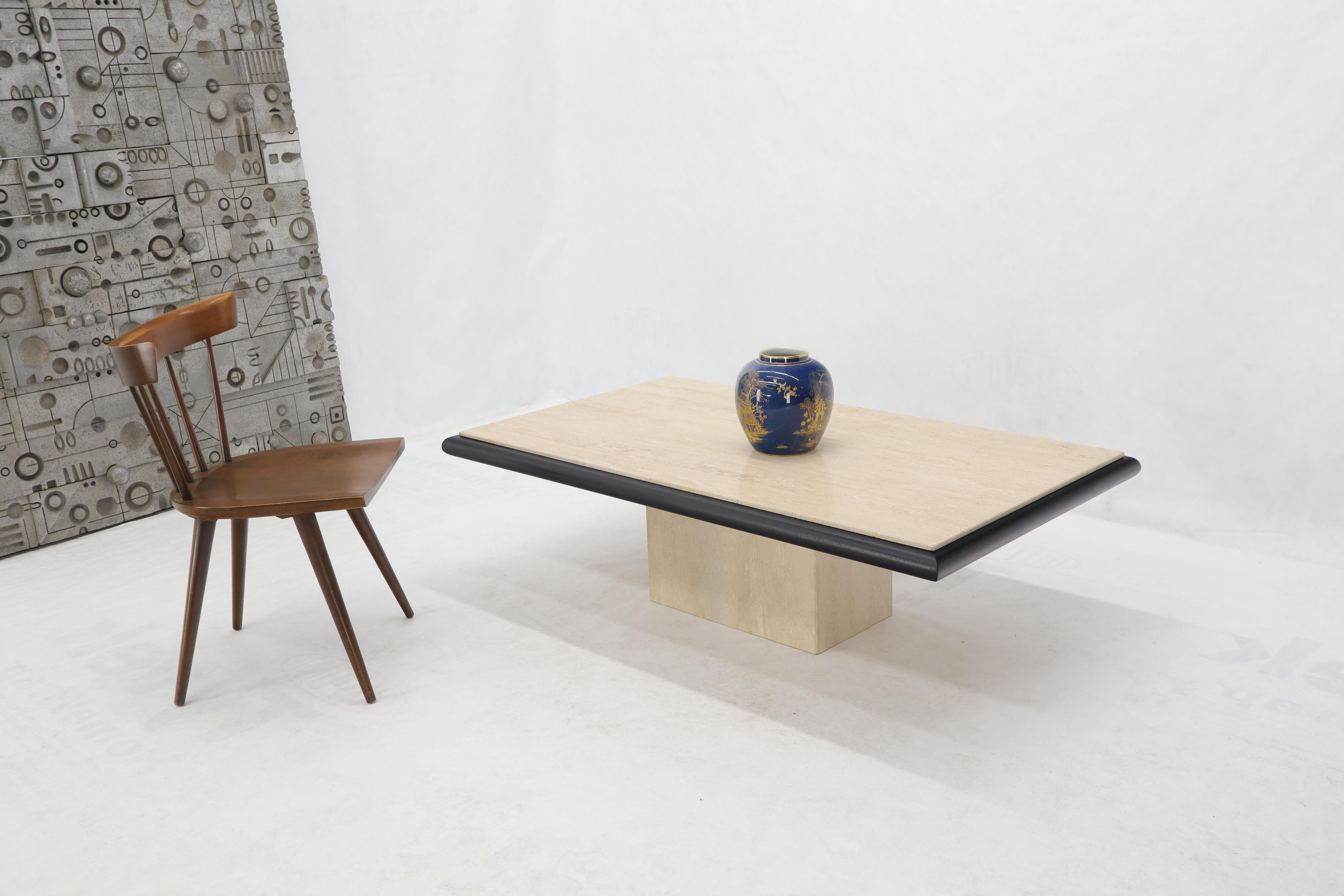 Midcentury Italian modern rectangular travertine coffee table with black lacquer wood bezel or frame.