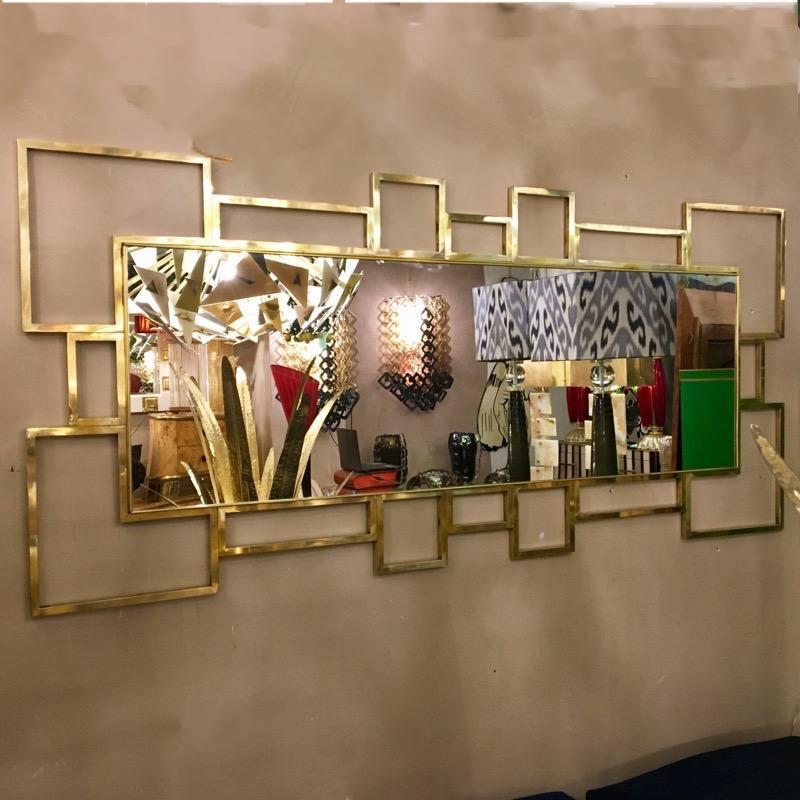 Italian rectangular brass frame mirror geometric shape. It can be placed both horizontally and vertically. The mirror without the frame measures cm 150 x 50.
  