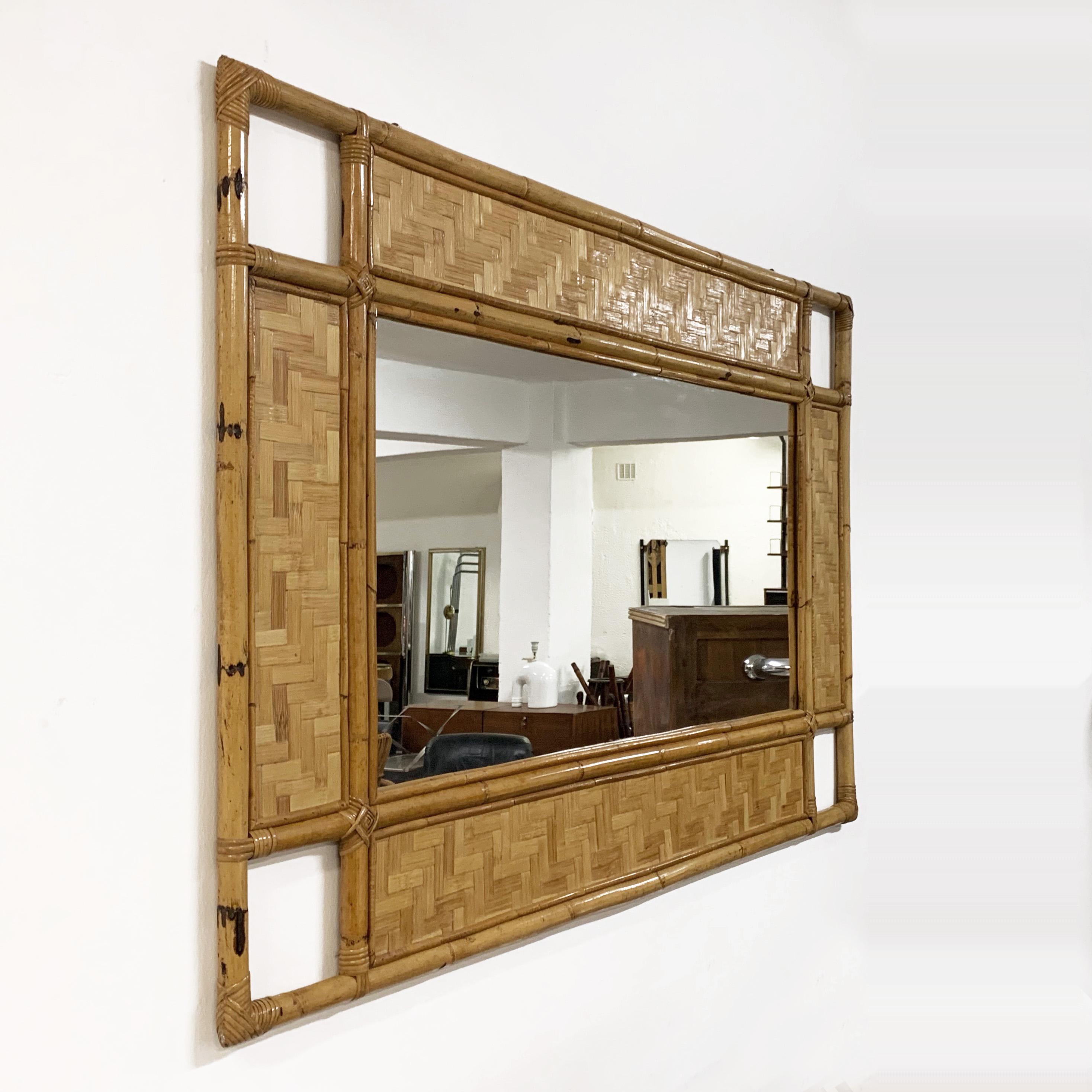 A large, beautiful rectangular mirror in Tiki style handmade with a bamboo rod. 

This amazing piece has highly decorative shapes thanks to his oriental accents and a large glass surface. This large mirror is in excellent condition and it is
