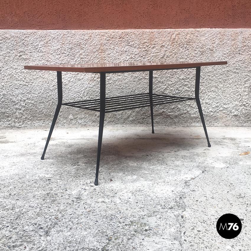 Italian rectangular wood and metal coffee table, 1950s
Rectangular wooden top coffee table with magazine rack and legs in metal rod
Very good condition, simple and suitable for any environment.