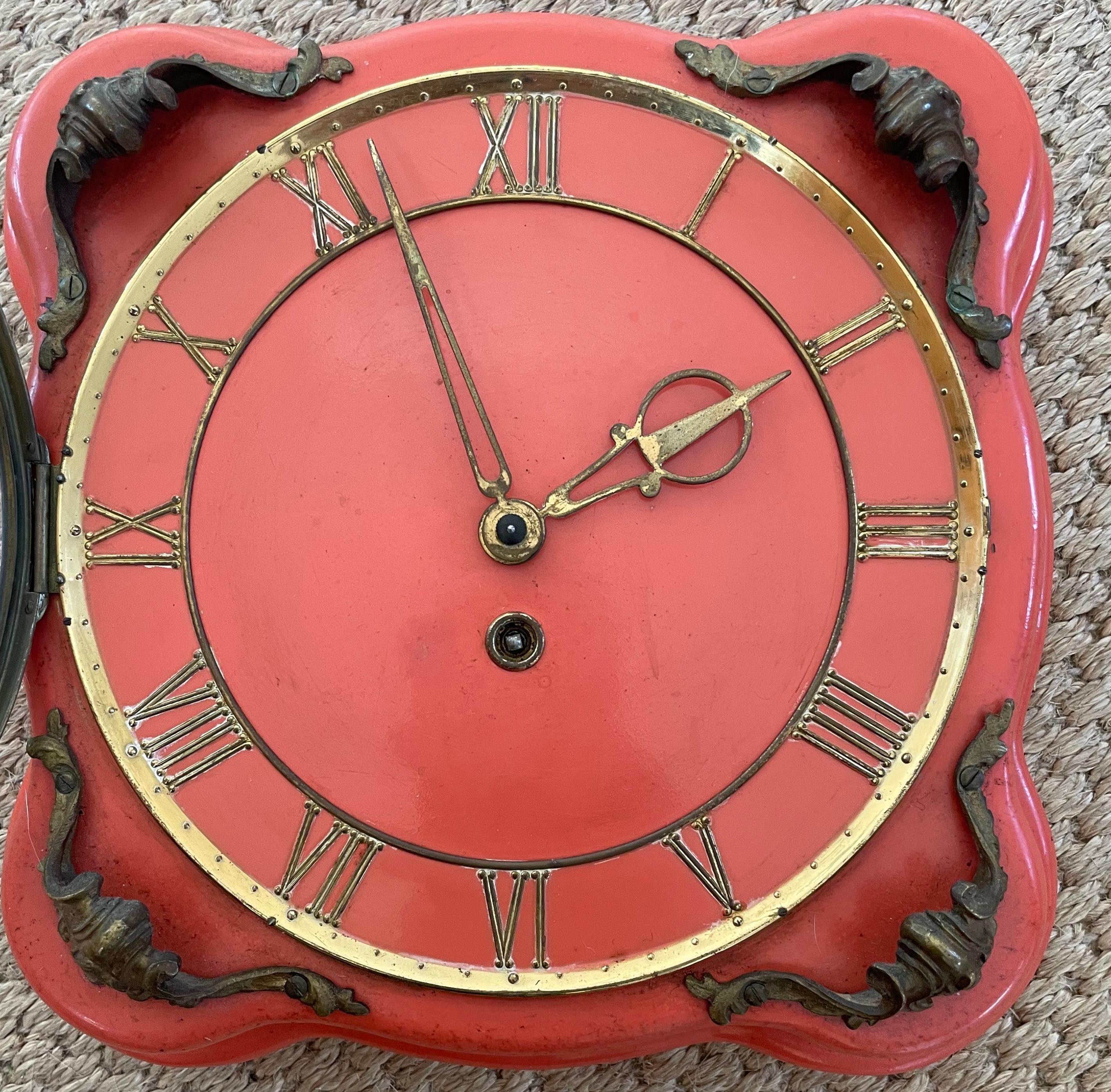 Italian red coral clock. Vintage forties coral enamel glazed clock with shaped border and brass roman numeral face with key for winding. Happily ticks away for 3 weeks. Italy circa 1940’s
Dimensions: 9