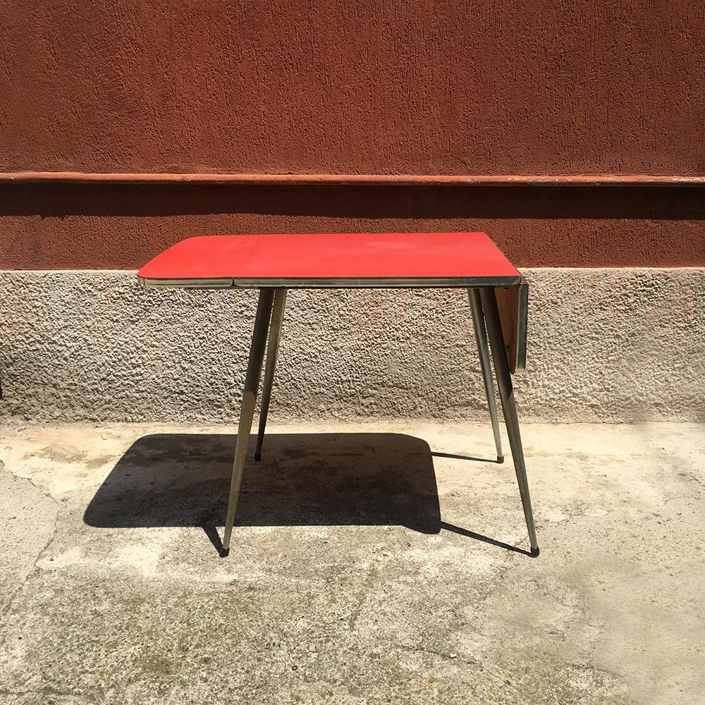Red Formica kitchen table from the 1960s, with double foldable top on both sides, with chromed steel frame and legs. Good condition, but with some defects on the surface and on the metal.
Size: 69 x 74 x 79 H cm
open 124 cm.