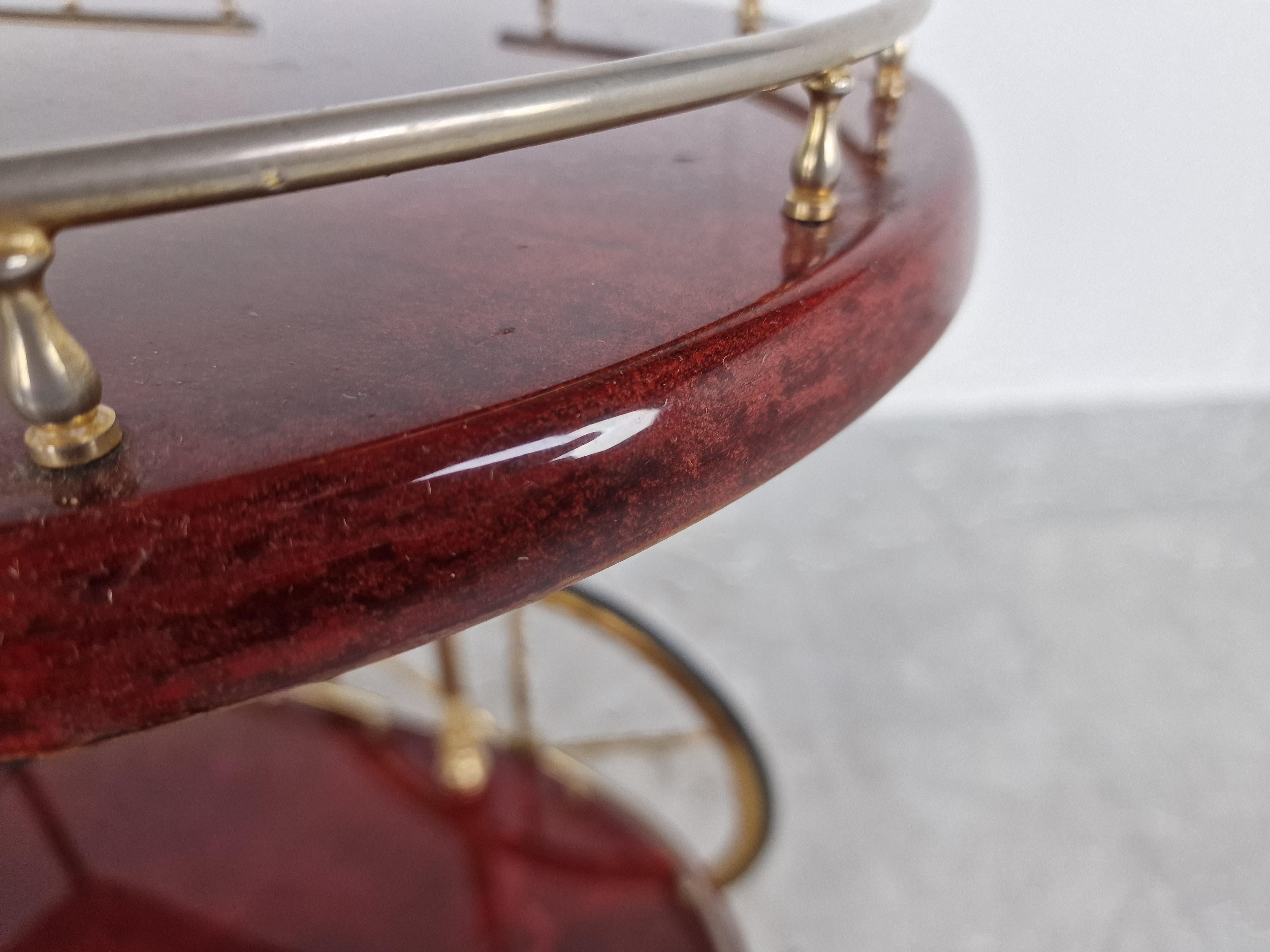 Very unique Aldo Tura Goatskin or parchment bar cart. This bar cart was made in Italy in the 1960s. 

Constructed of thickly lacquered goatskin / parchment and gilt metal hardware. 

Perfect bar or serving cart, or as rolling storage in an