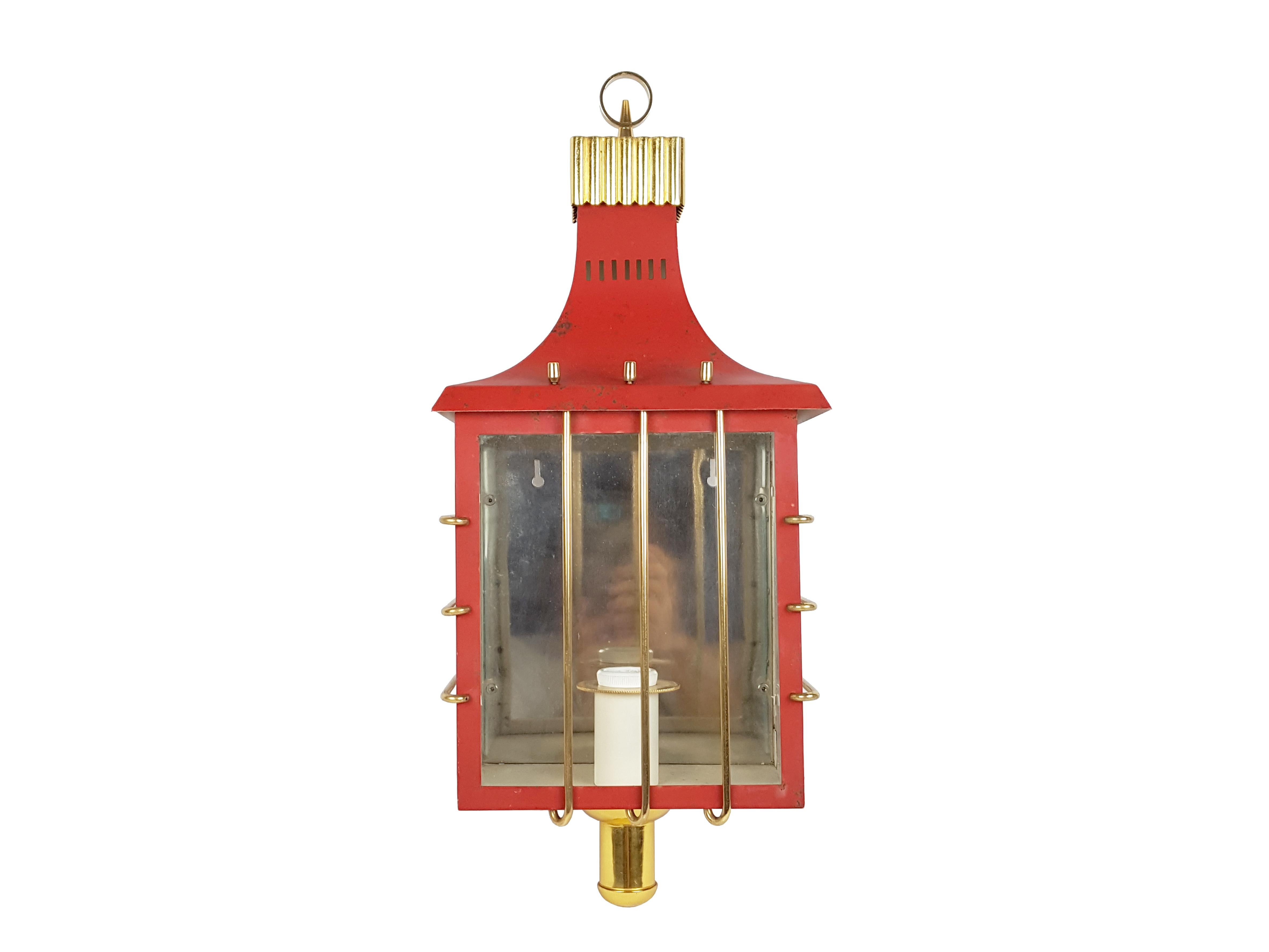 Large beautiful and decorative wall lamp produced in Italy in the late 1950s. It is made from a red painted metal structure with glass and brass decorative elements. Visible oxidation defects and paint losses in the upper side, as showed in