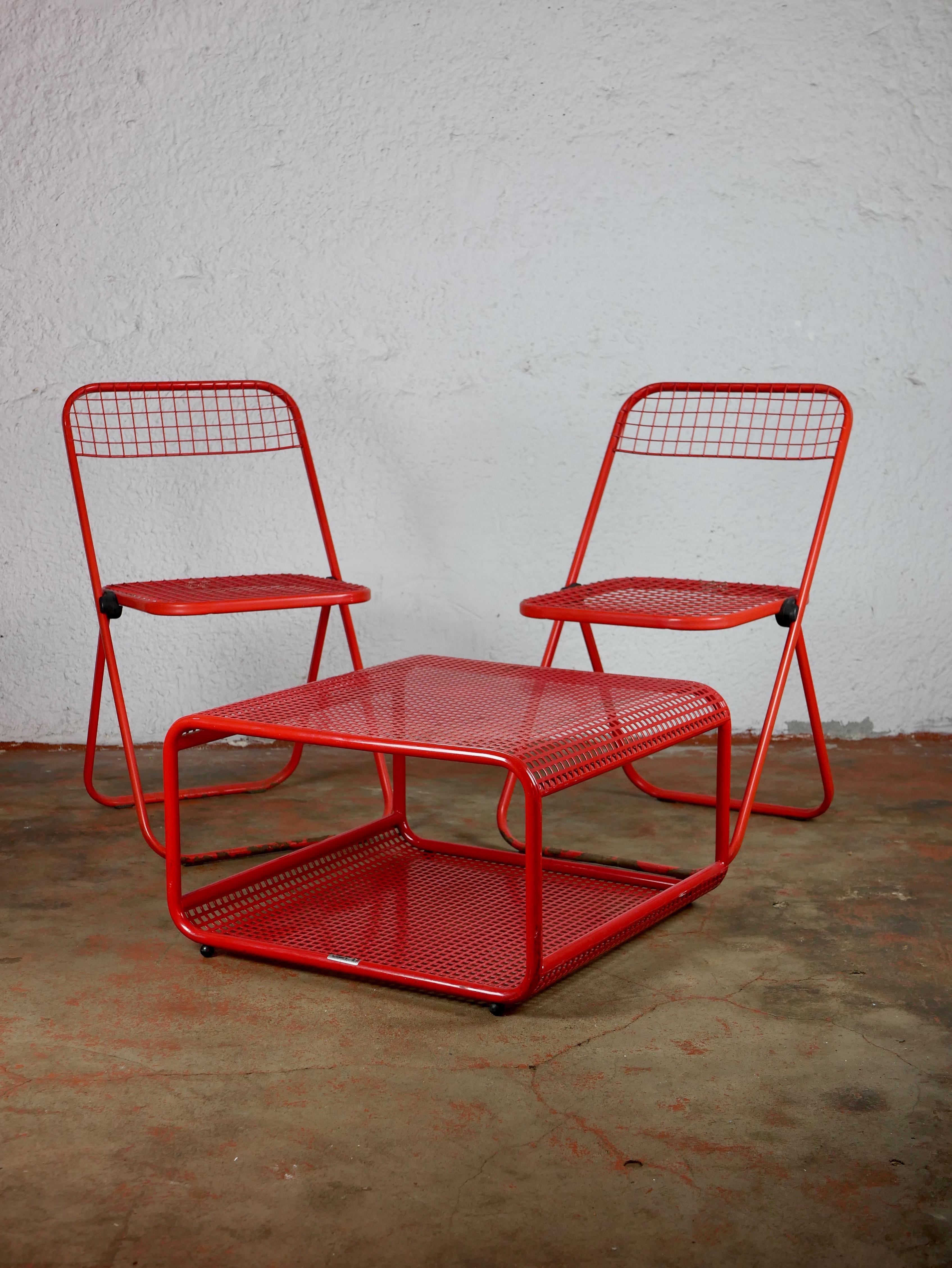 Colorful nice metal coffee table from Italian brand Talin Vincenza, made in the 1980s.
Perforated metal, red lacquered.
Perfect dimensions, and with a storage compartment useful for magazines and whatever you want to store.
 