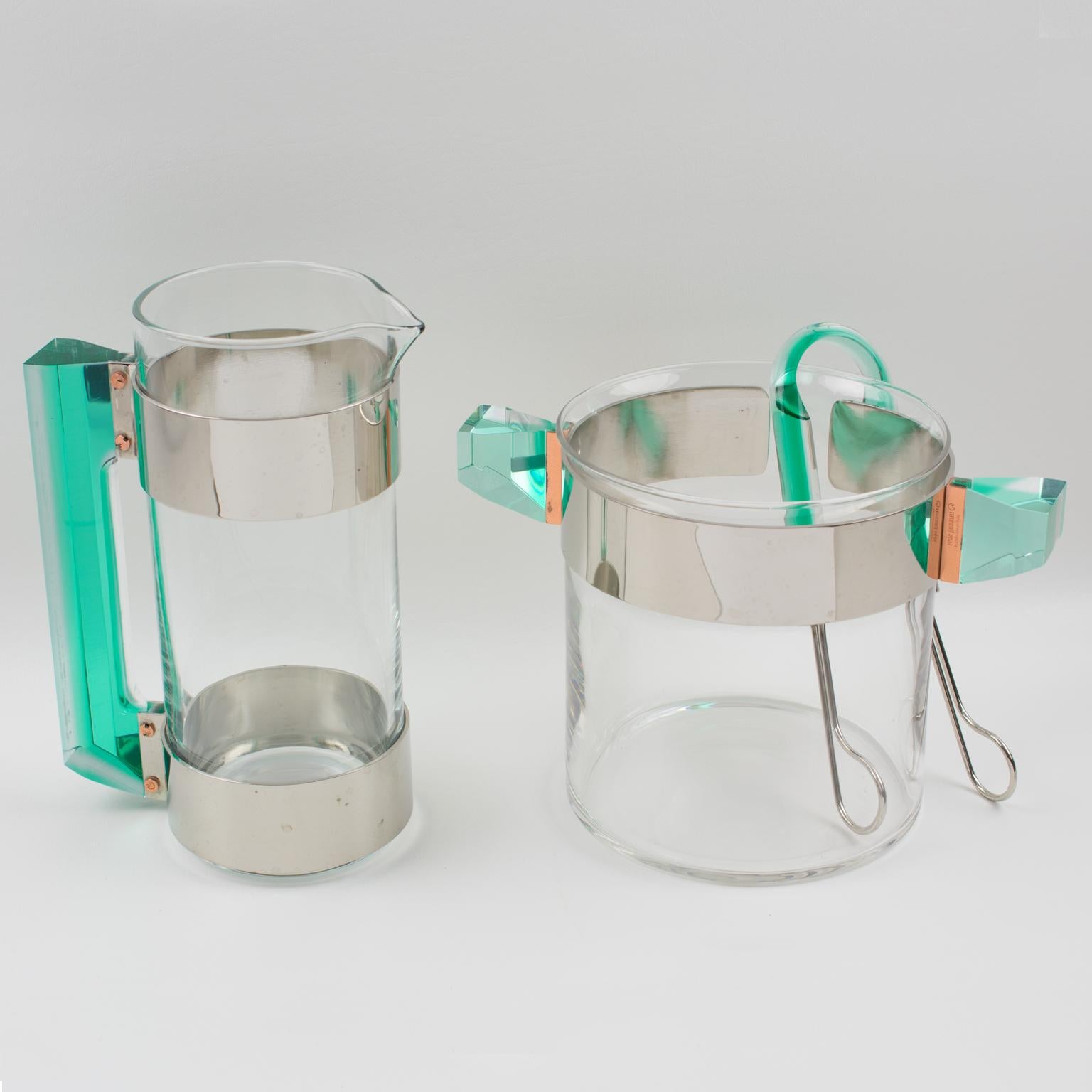 A stylish barware set designed by Italian Rede Guzzini from the 1970s. This set includes a martini pitcher or jug and an ice bucket with its pair of tongs. Molded glass containers with silver plate and copper metal framing compliment with incredible