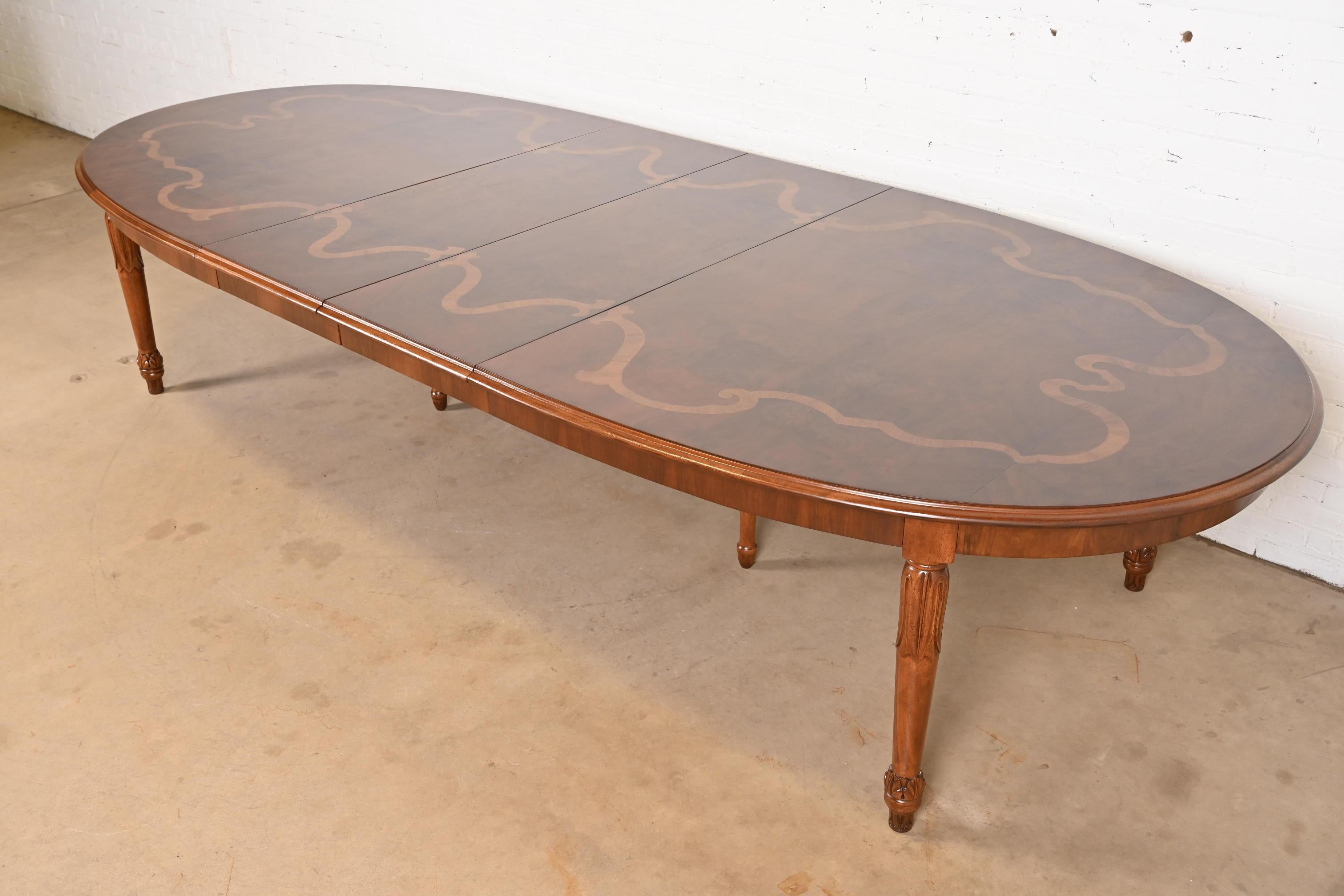 A beautiful Italian Regency Louis XVI style extension dining table

In the manner of Henredon

Italy, Circa Late 20th Century

Gorgeous burled walnut top, with satinwood inlay, and solid carved walnut legs.

Measures: 104