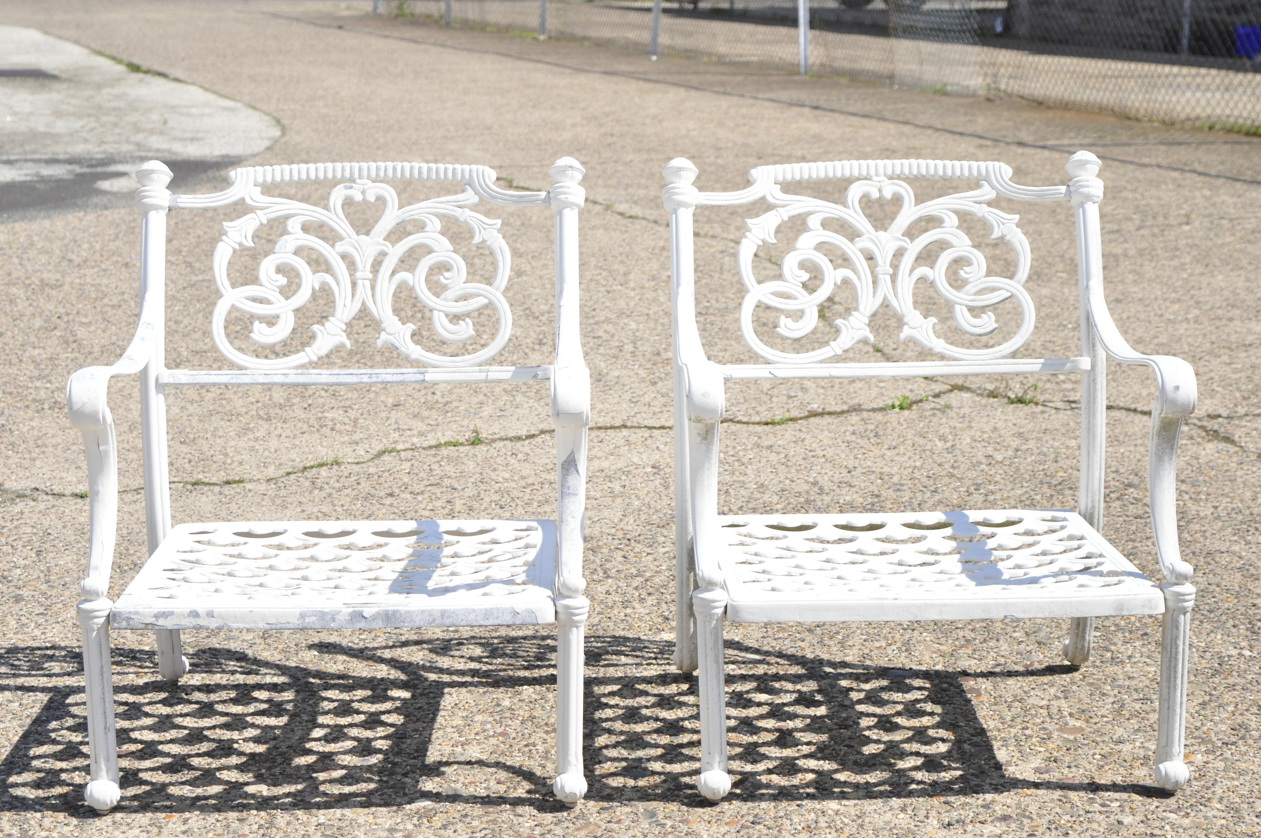 Modern Italian Regency Style Scrollwork cast aluminum Garden Patio club lounge arm chairs - a pair. Item features fancy scrollwork backs, low comfortable forms, lattice fretwork seats, cast aluminum construction, great style and form. Circa Late
