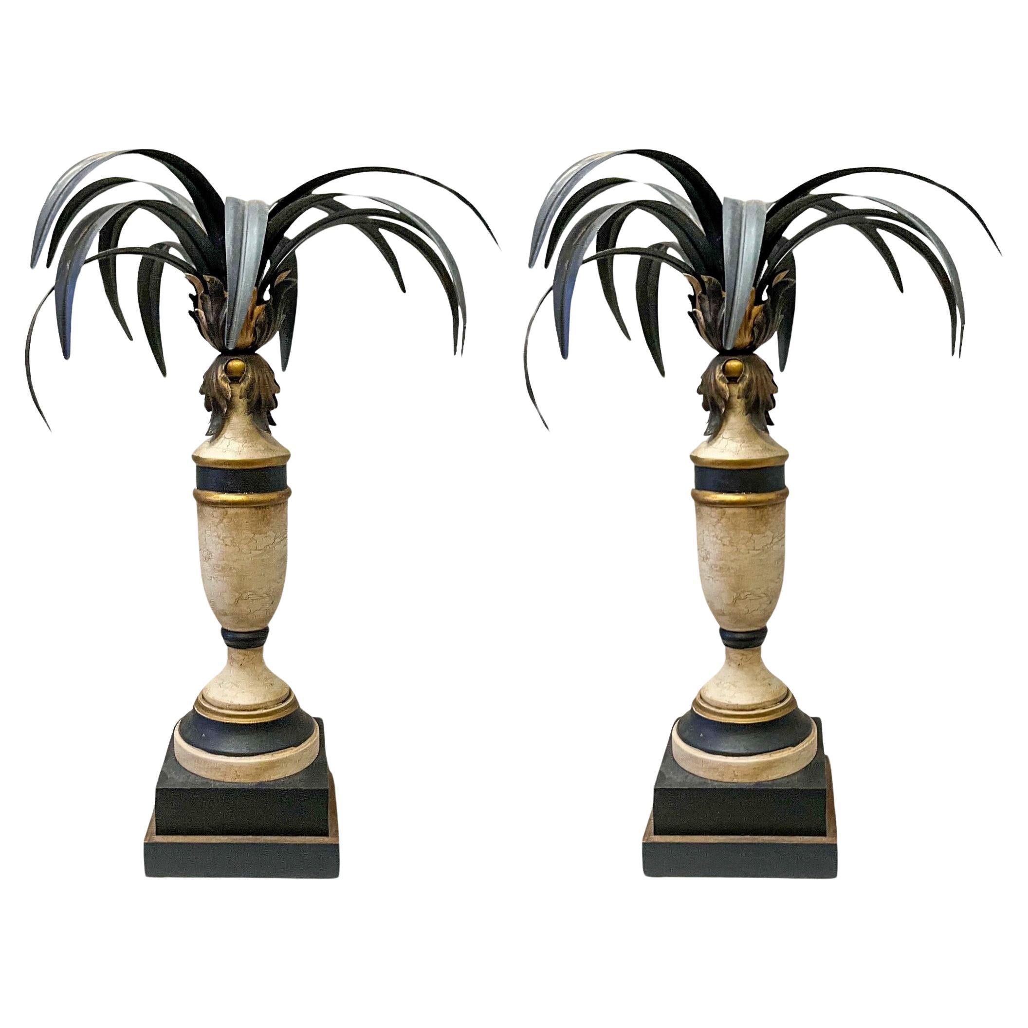 This is pair of regency style Italian candlesticks with tole palm fronds. The stems are carved wood with bases that are 6.25 inches square. They are in very good vintage condition. 