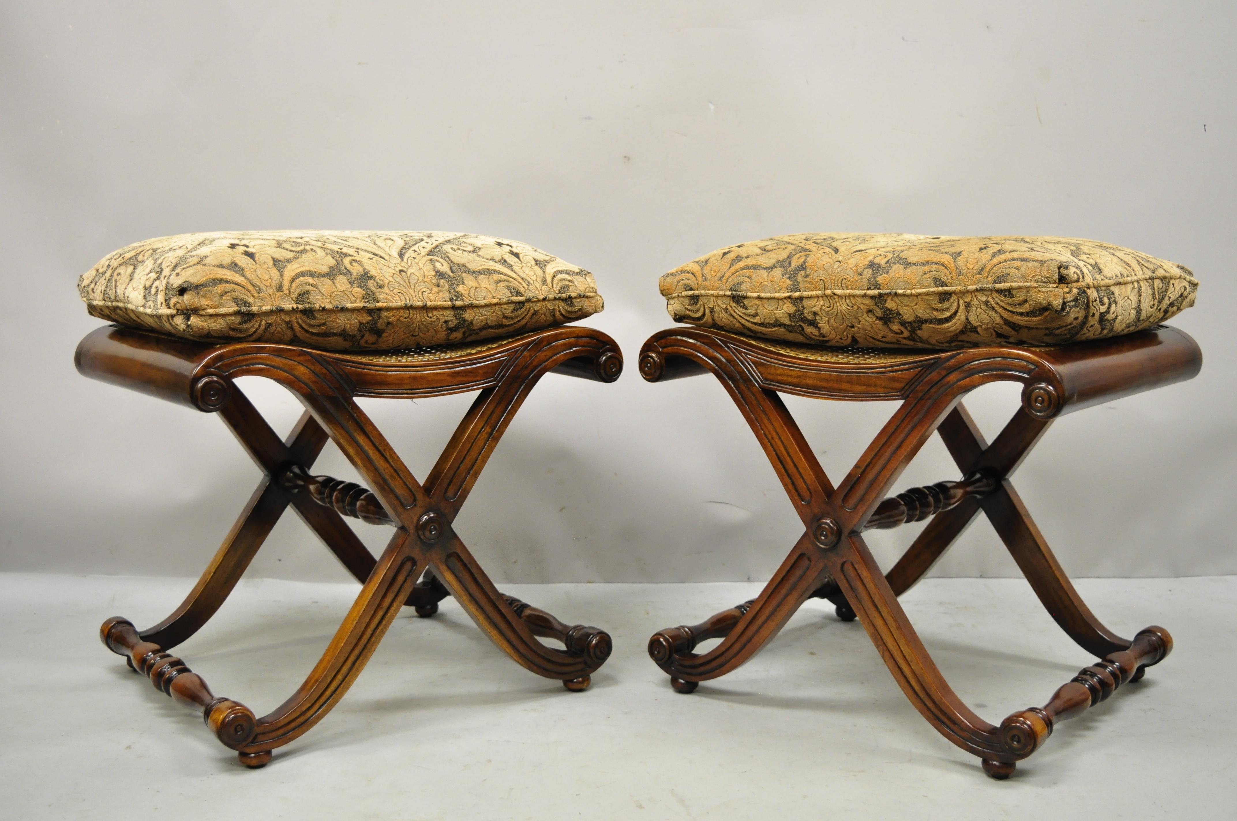 Italian Regency style mahogany and cane curule X-frame stools with cushions - a pair. Item features cane seat, loose pillows, curule x-form stretcher bases, solid wood construction, beautiful wood grain, nicely carved details, very nice pair,