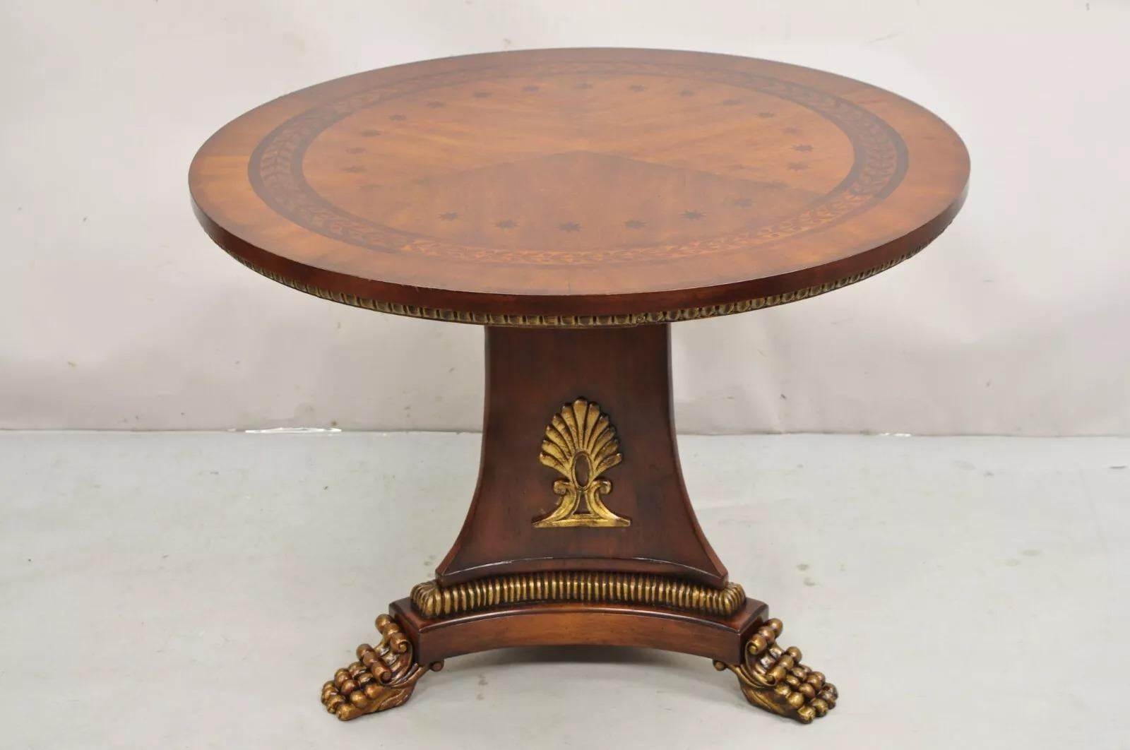 Italian Regency Style Marquetry Inlay Paw Foot Pedestal Base Round Center Table. Item features a nice inlaid top, tripod carved paw foot base, very stately center table. Circa Late 20th Century. Measurements: 29.5