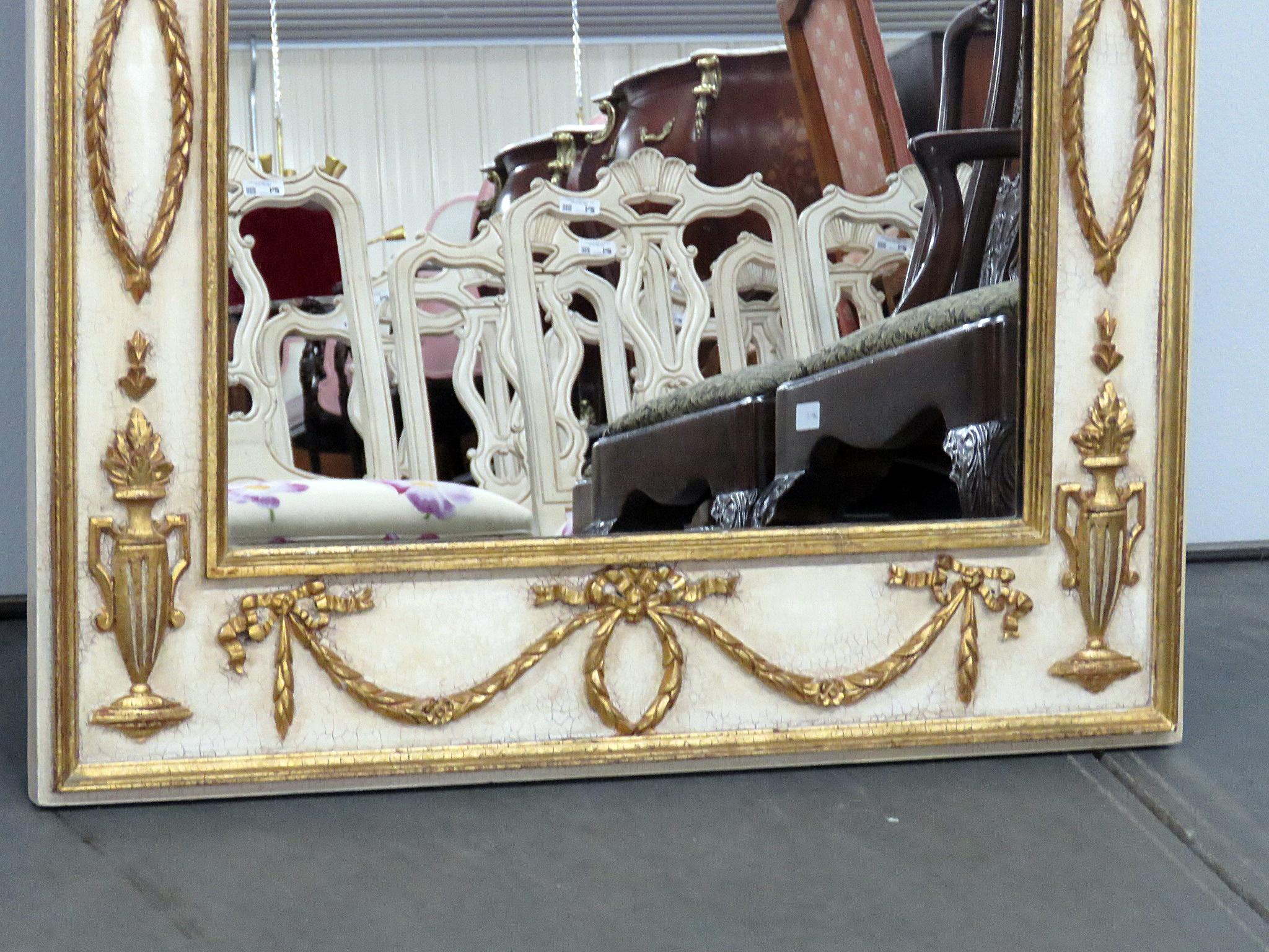 Italian Regency style distressed painted parcel-gilt wall mirror.