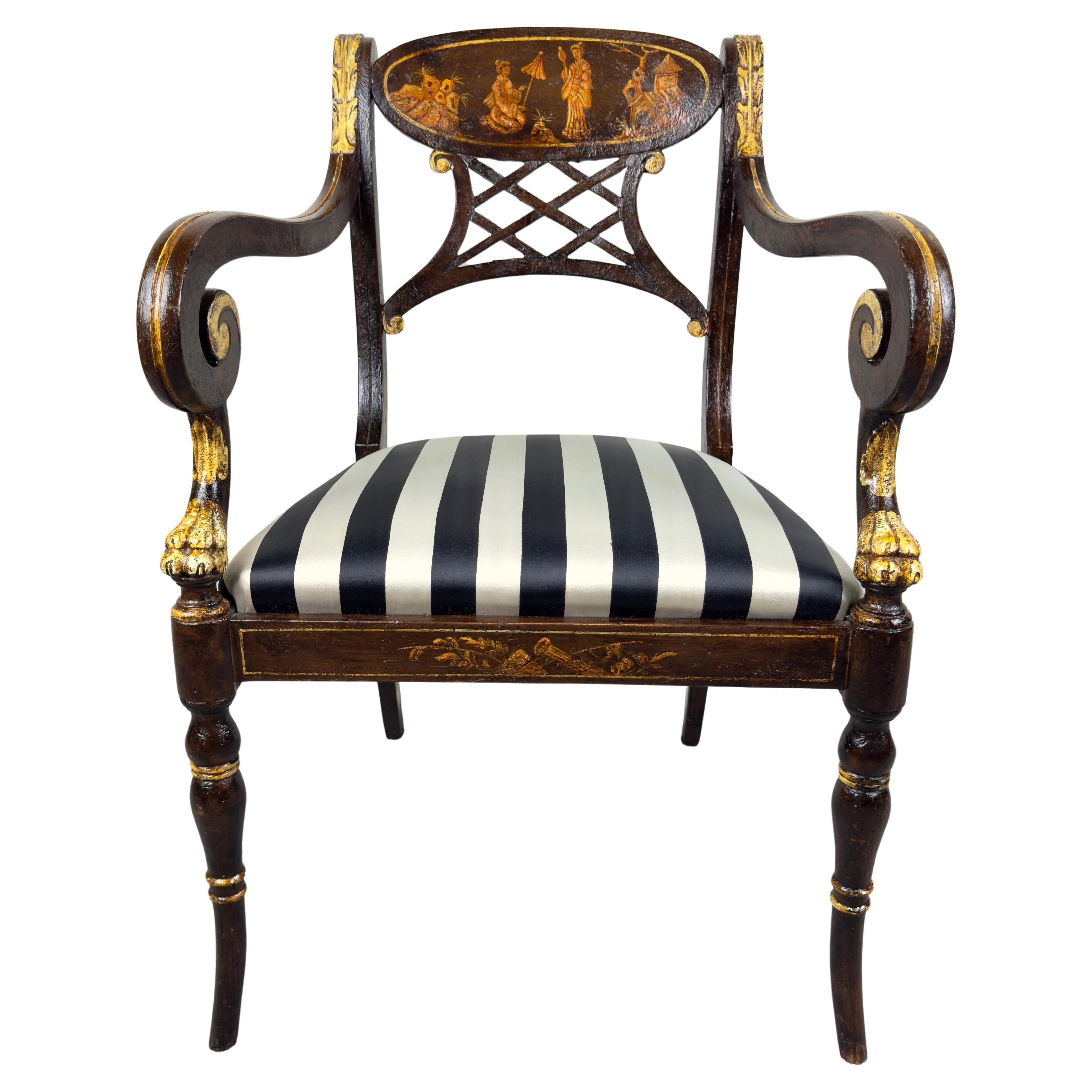  An elegant Italian regency style ebonized armchair or side chair. The chair is ebonized and embellished with gold accents, especially on the armrests and legs, adding to the luxurious feel, which is typical of Regency furniture.
The regency style