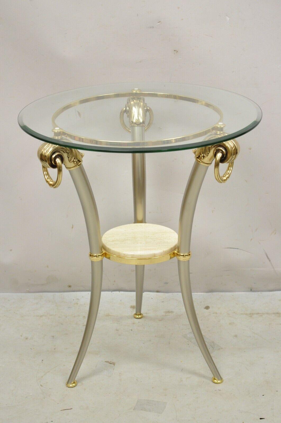 Vintage Italian Regency Style Steel and Brass Tripod Base Round Glass Top Side Table. Item features a beveled edge round glass top, small round travertine stone lower tier, steel metal frame, brass accents, quality craftsmanship, great style and