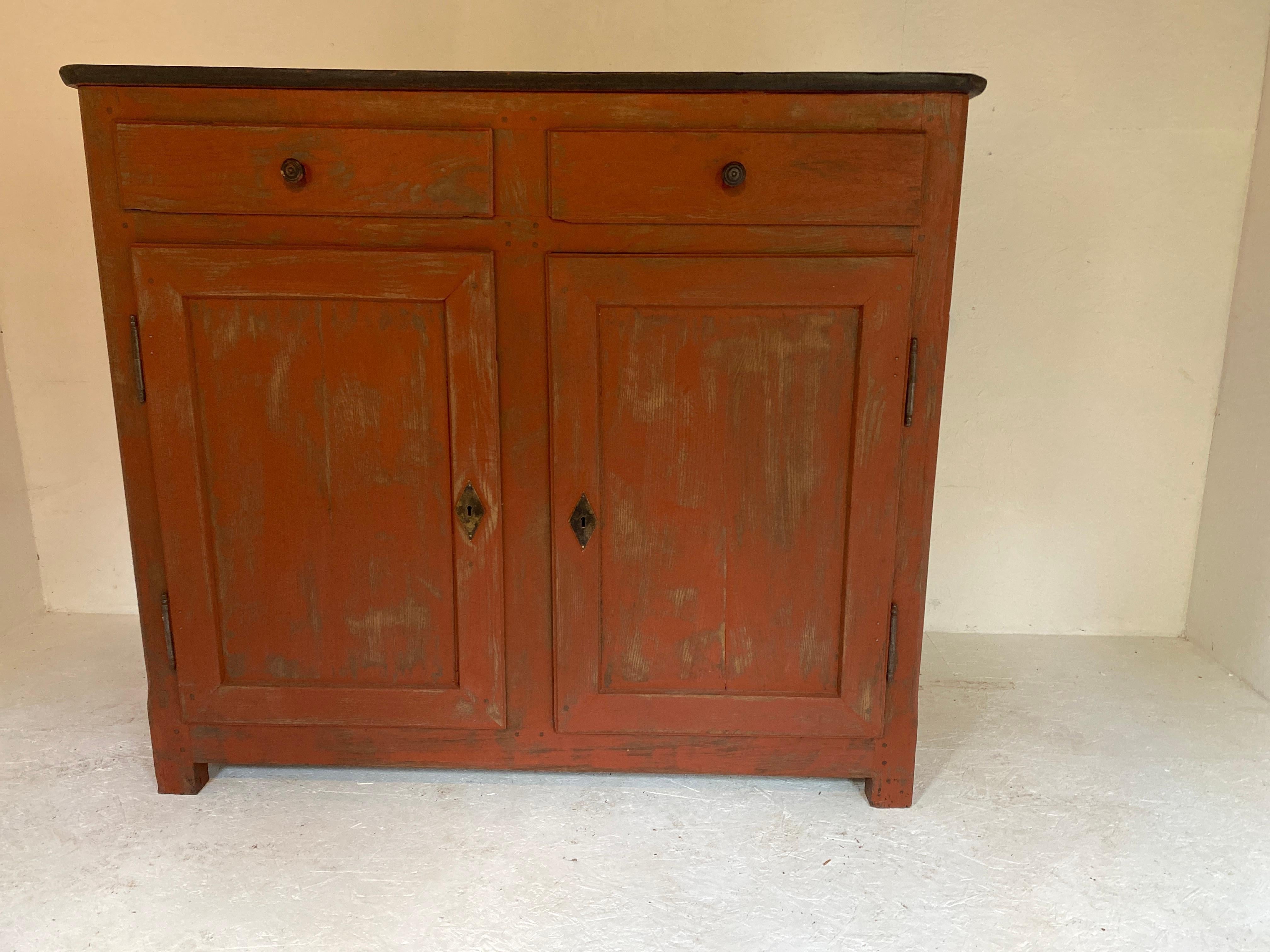 Magnificent sideboard dating from the 19th century from Italy in the Tuscan countryside two wide doors with an intermediate upright surmounted by two drawers very pretty polychrome red orange and dark gray tablet inside a board and a large storage