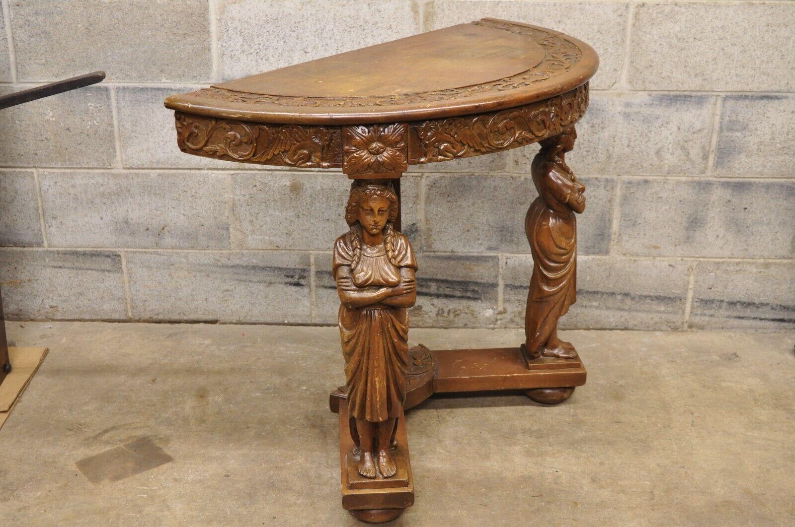 Antique Italian renaissance carved walnut figural half round demilune console table. Item features a full carved female figures, half round demilune top, carved top and skirt, very nice antique item. Circa early 20th century. Measurements: 30