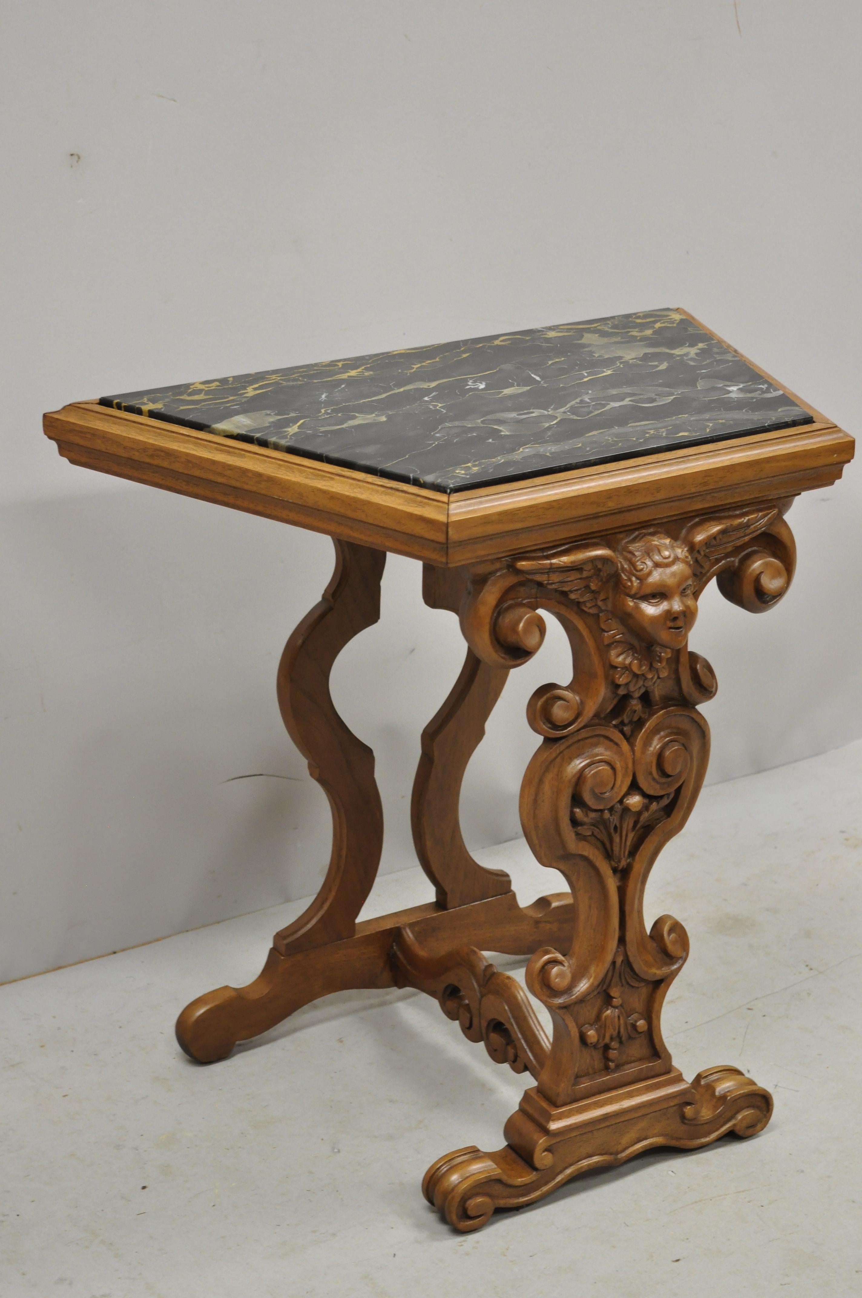 Antique Italian Renaissance figural carved marble top side table with winged cherub head. Listing includes an inset marble top, figural carved 3 dimensional winged cherub head, stretcher base, solid wood frame, very nice antique item, great style