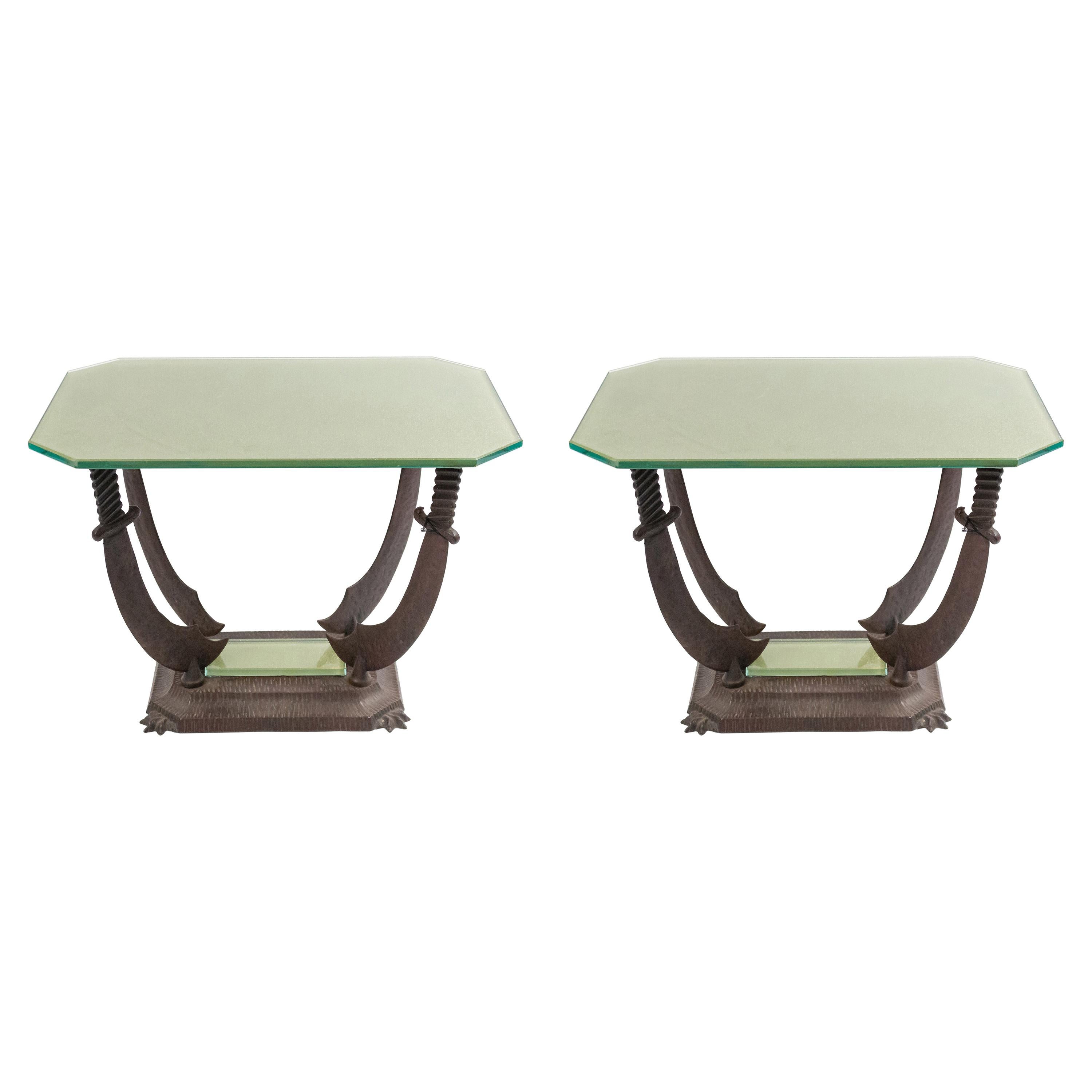 2 early 20th century Italian Renaissance style iron low end tables having a gold glass top supported on 4 sabers resting on a rectangular base (Priced Each).