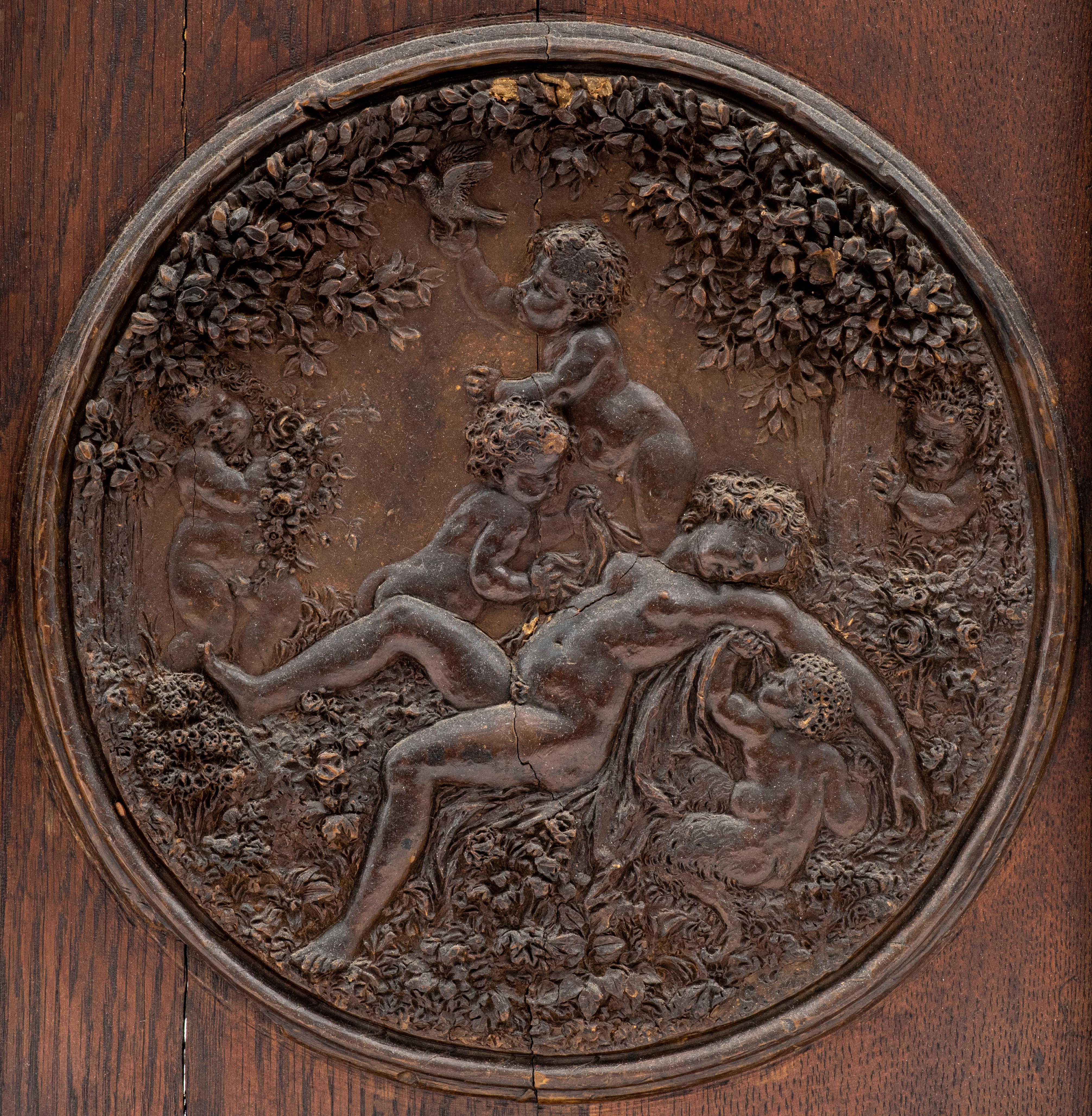 Hand-carved wooden medallion of sleeping goddess surrounded by putti in the manner of the Italian Renaissance. 
Image: 12.5