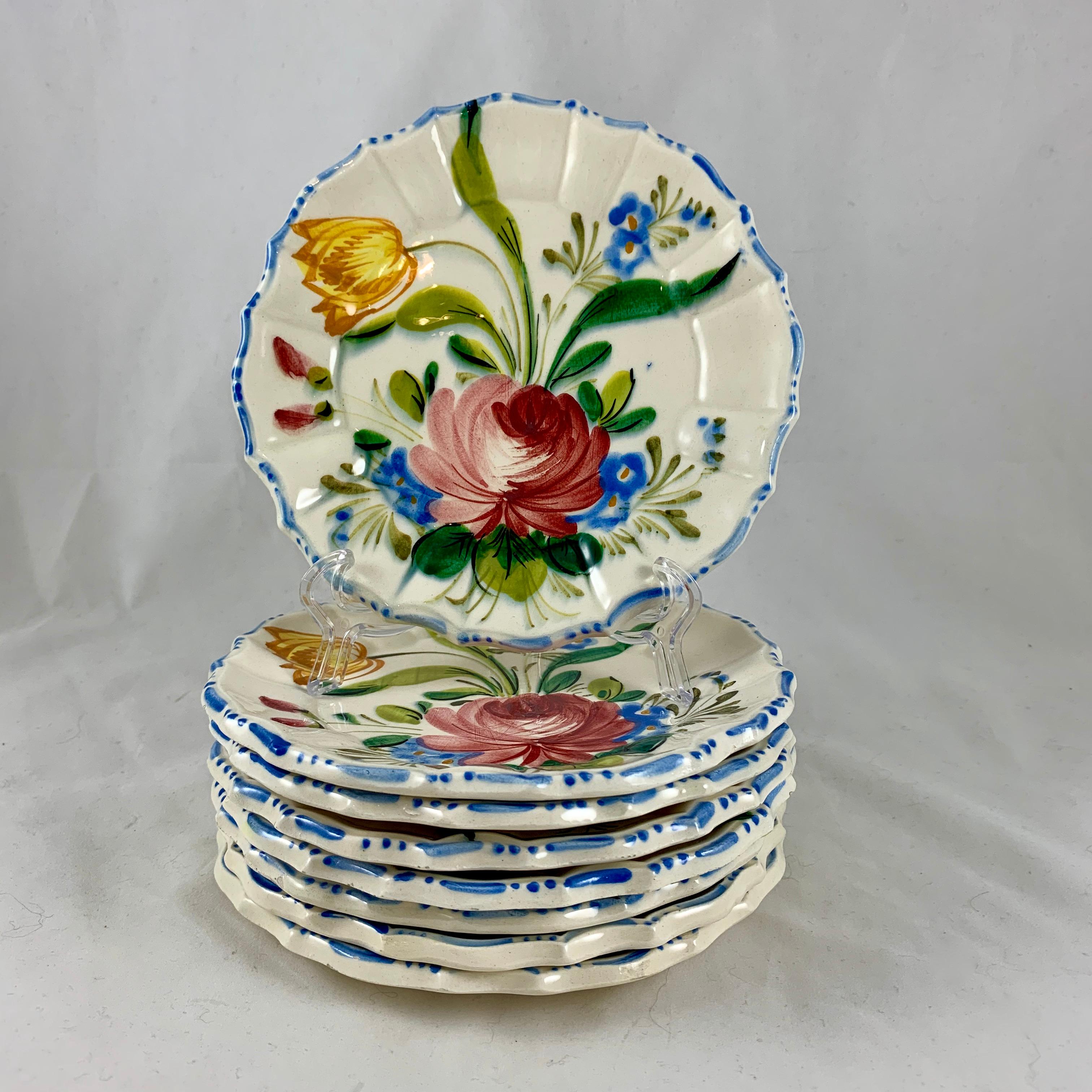 In the Renaissance Revival Rose pattern from the Barrettoni già Antonibon pottery in Nove, Italy, a set of eight hand painted plates, circa 1930s.

An overall floral decoration with a bright blue dash and dot border on a scallop rimmed plate.