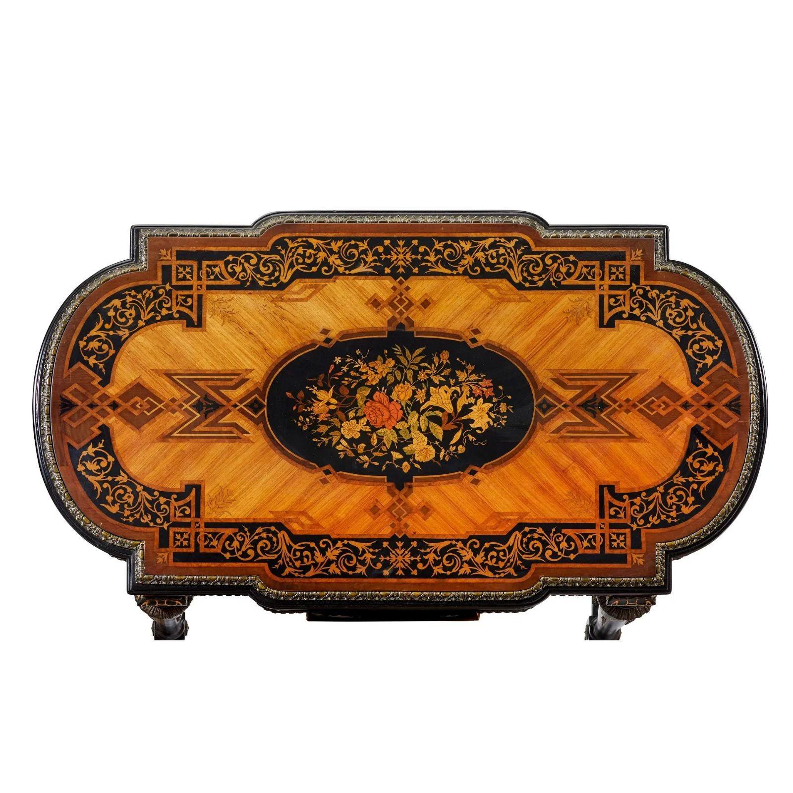 Italian Renaissance Revival Library table, Mid/late 19th century

In satinwood, burl, ebony, and other timber with marquetry veneered top with floral banding and central plaque, bronze mounted with gilt and ebonized highlights
