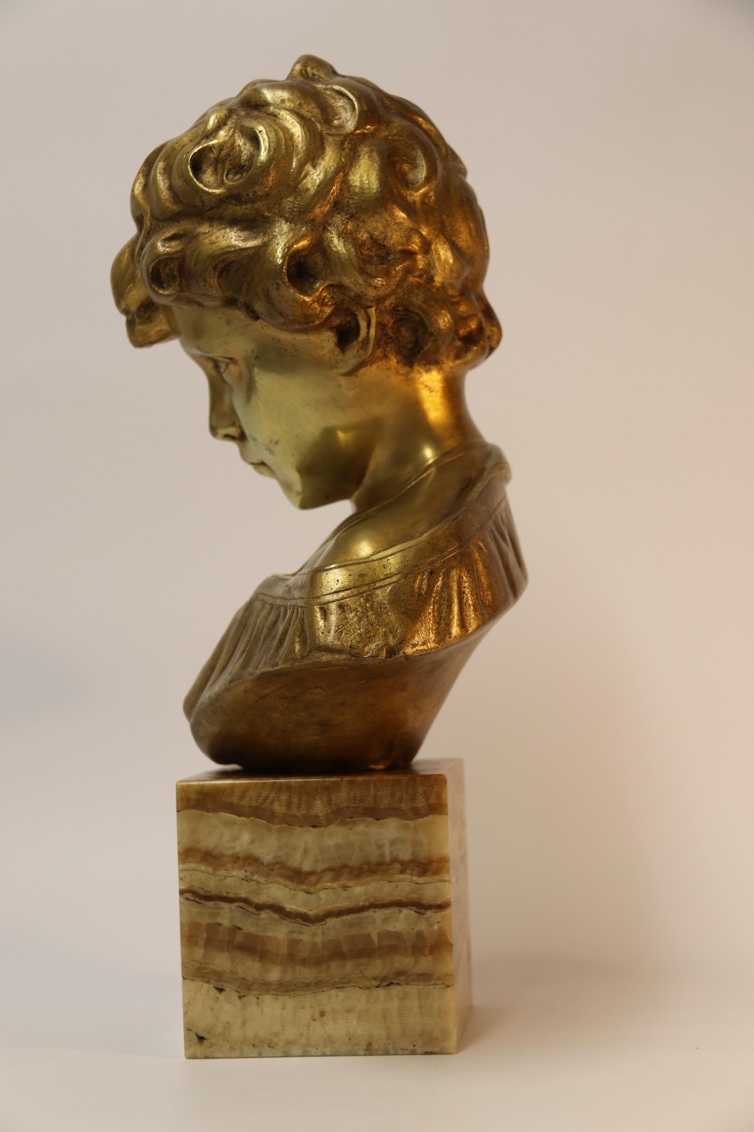 Renaissance Bronze Bust of a Boy on a marble base, signed Donatello, Circa 1930 For Sale
