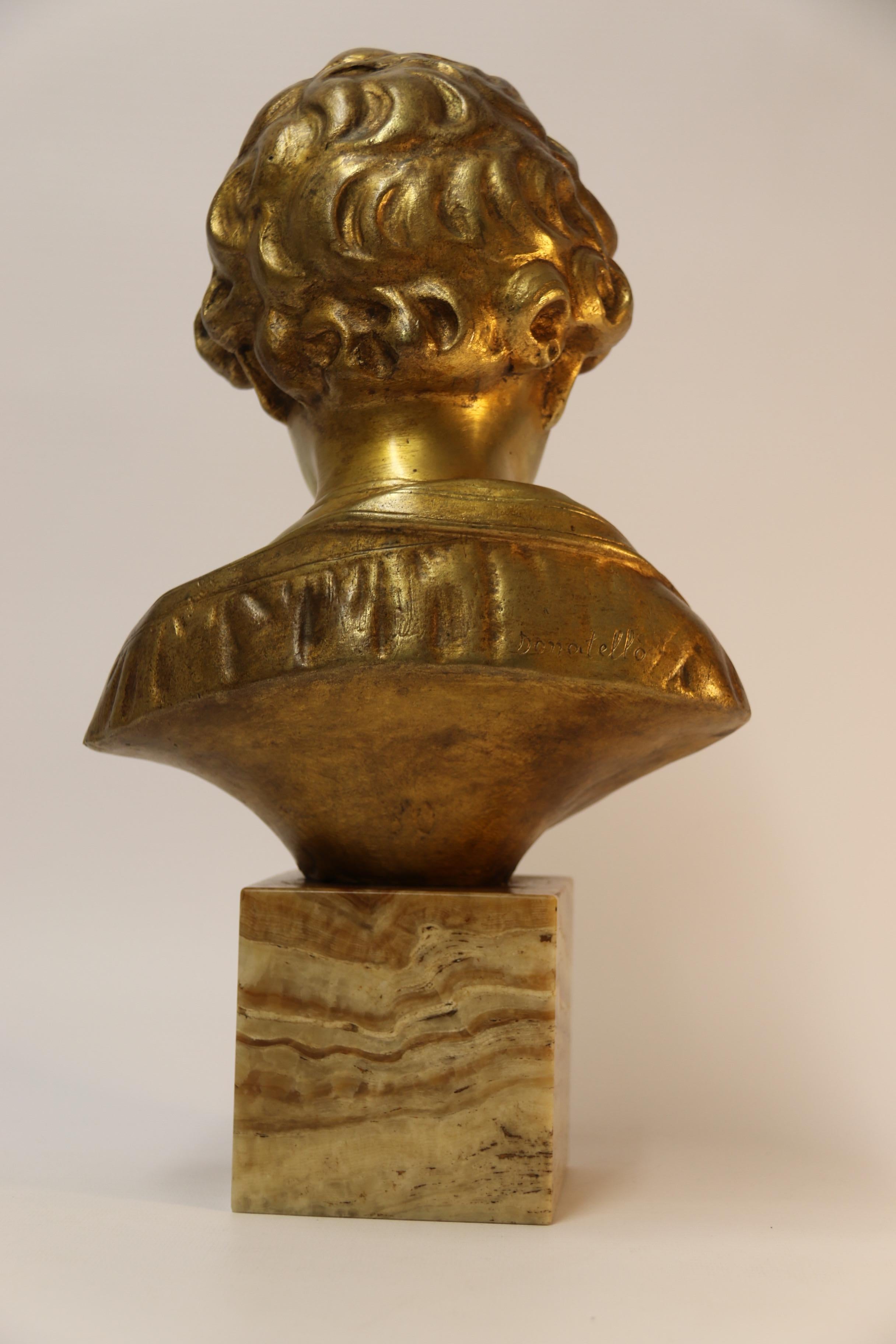 Italian Bronze Bust of a Boy on a marble base, signed Donatello, Circa 1930 For Sale